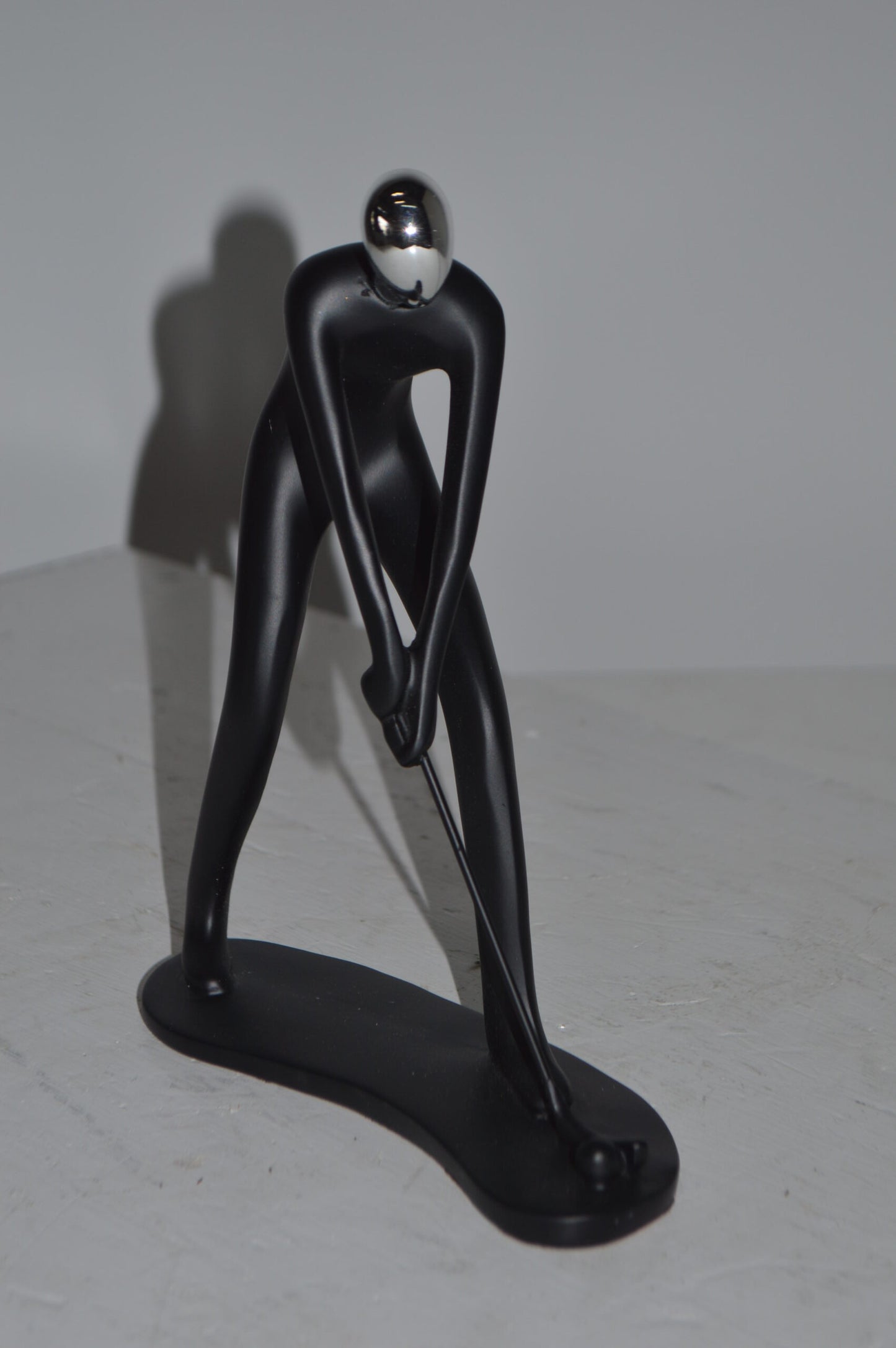 Modern art Black Golfer with Silver Head Resin Statue - Size: 7"L x 2"W x 9"H.
