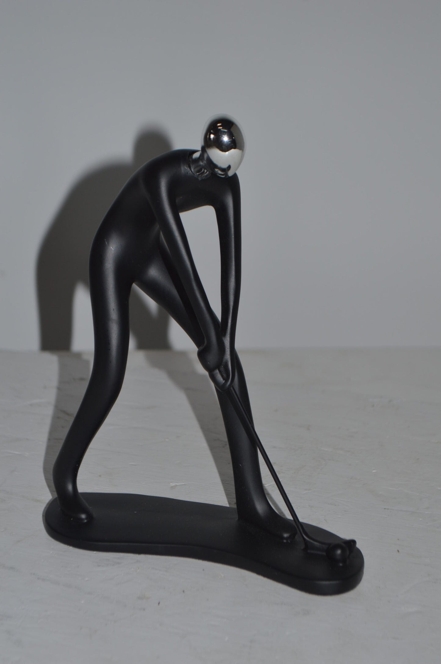 Modern art Black Golfer with Silver Head Resin Statue - Size: 7"L x 2"W x 9"H.