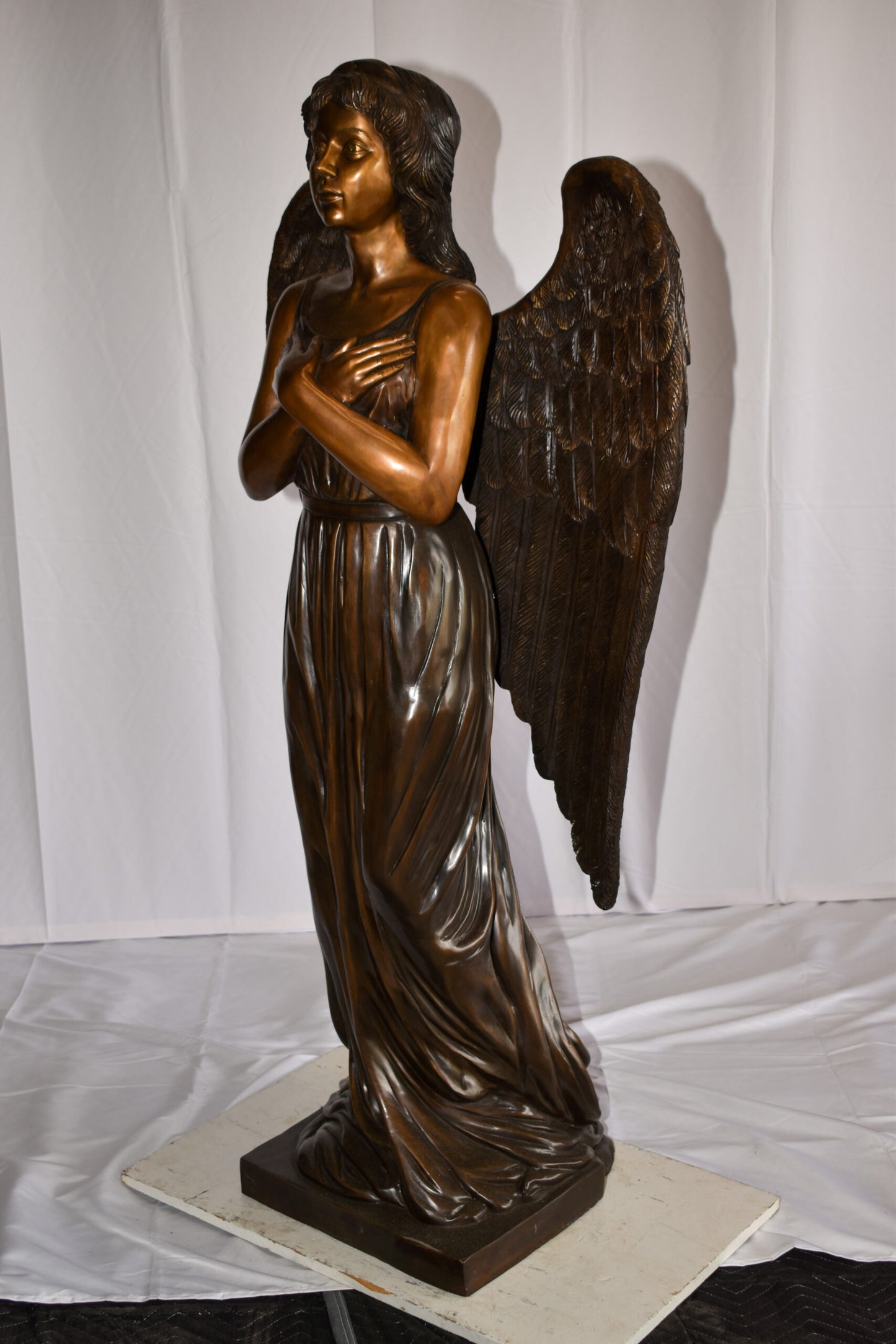 Angel Standing with her hands folded bronze Statue Size: 29" x 16" x 63"H
