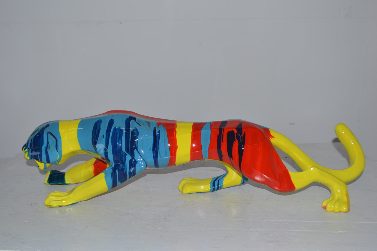 Modern Art Medium Colored Jaguar Statue Made of Resin - Size: 27"L x 7"W x 7"H.