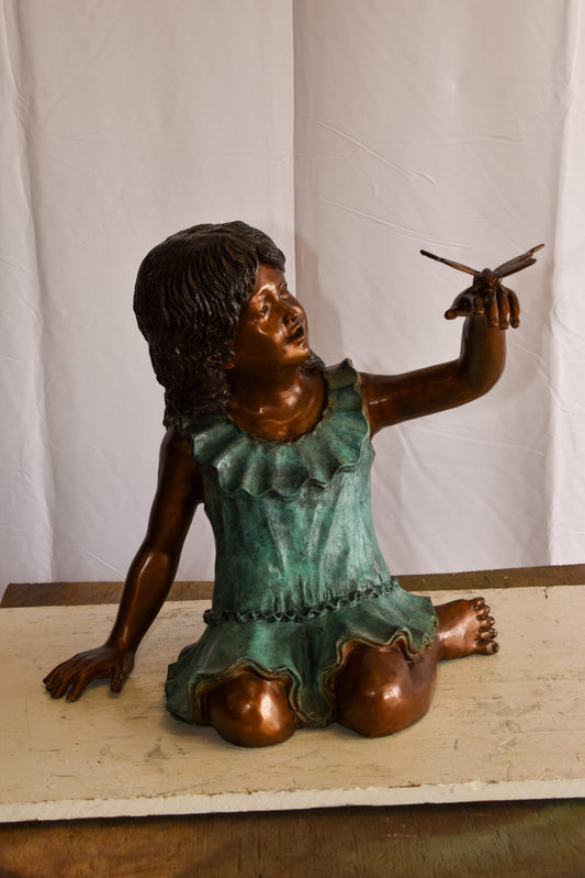 A Little Girl Playing with a Buterfly Bronze Statue 21" x 15" x 19"H