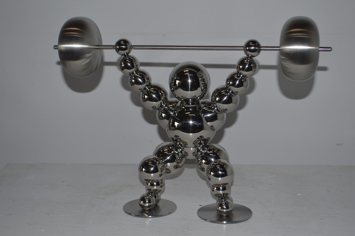 Modern Art Weightlifter Catch Position Chrome Statue - Size: 20"L x 7"W x 15"H.