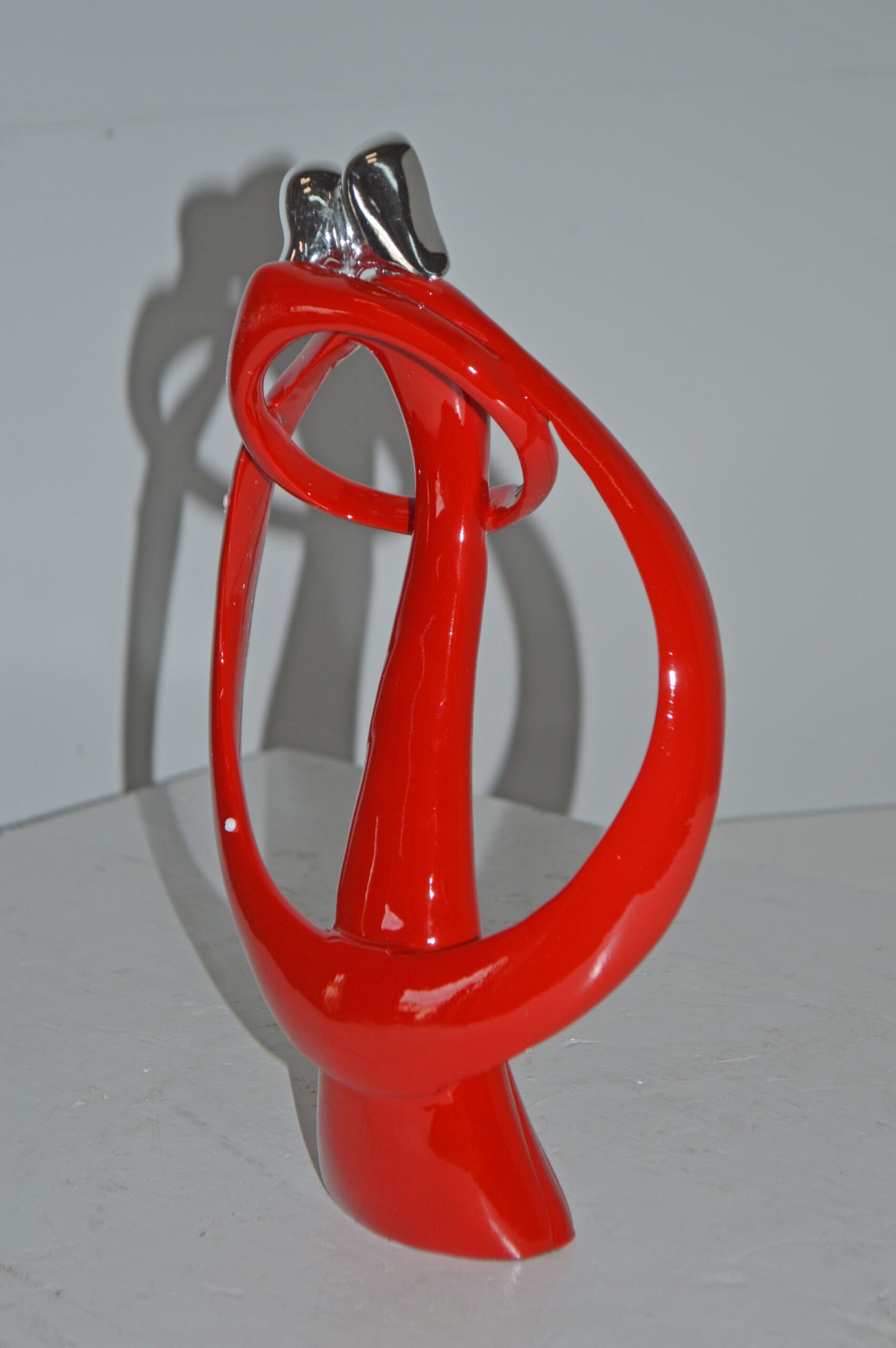 Modern Art of a Couple Hugging Red Chrome Resin Statue - Size: 8"L x 2"W x 12"H