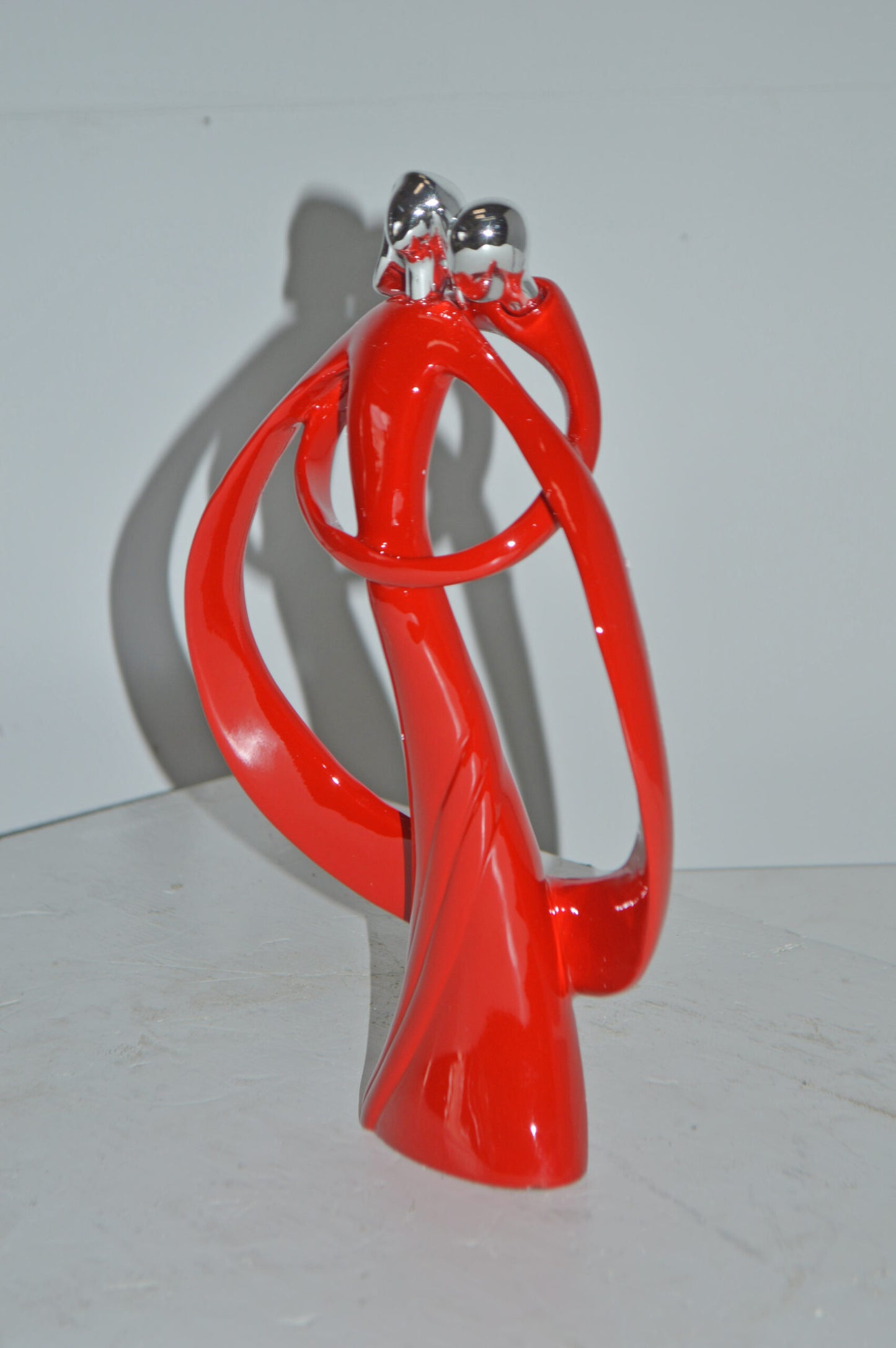 Modern Art of a Couple Hugging Red Chrome Resin Statue - Size: 8"L x 2"W x 12"H