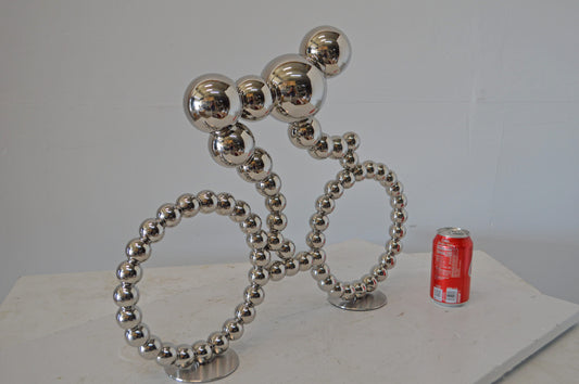 Modern Art Rider on His Bicycle Chrome Statue - Size: 22"L x 4"W x 17"H.