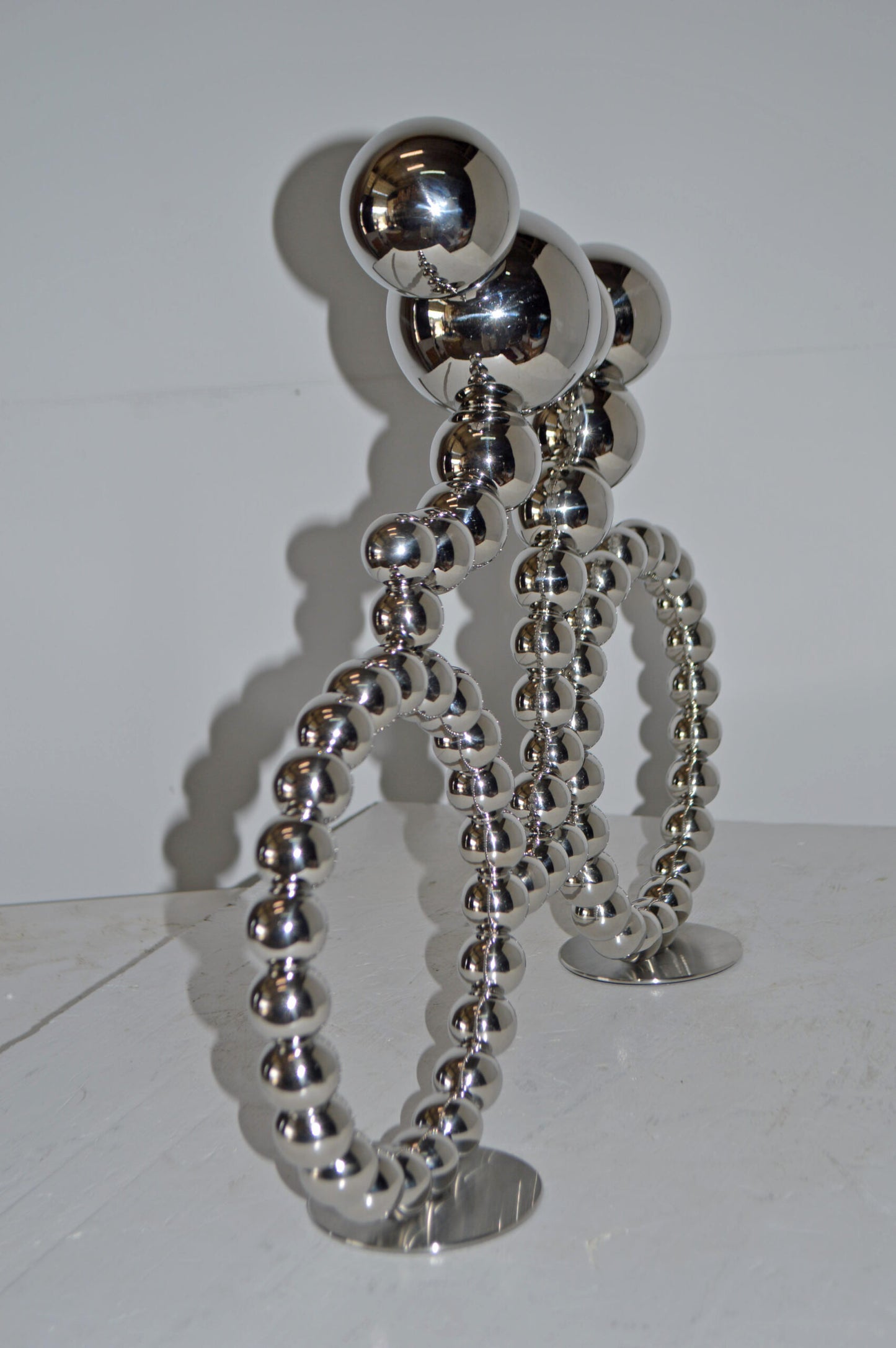 Modern Art Rider on His Bicycle Chrome Statue - Size: 22"L x 4"W x 17"H.