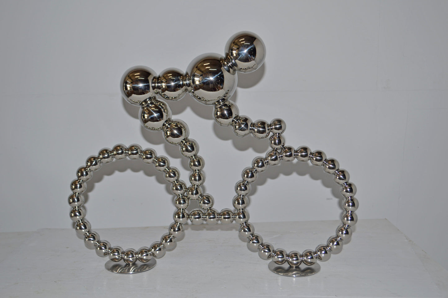 Modern Art Rider on His Bicycle Chrome Statue - Size: 22"L x 4"W x 17"H.