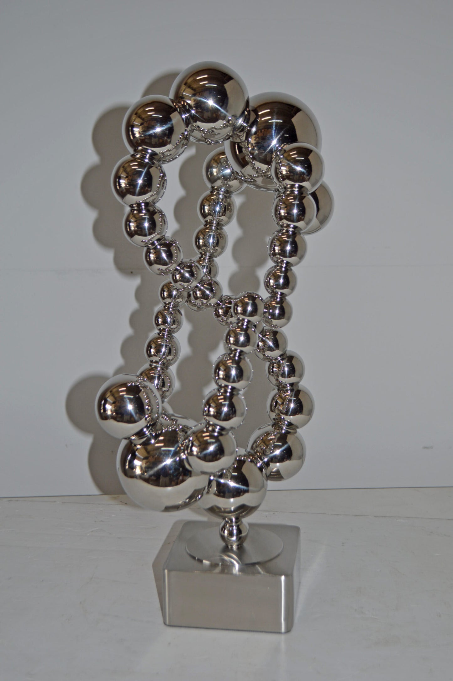 Modern Art Abstract Made of Chrome Balls Statue - Size: 11"L x 10"W x 22"H.
