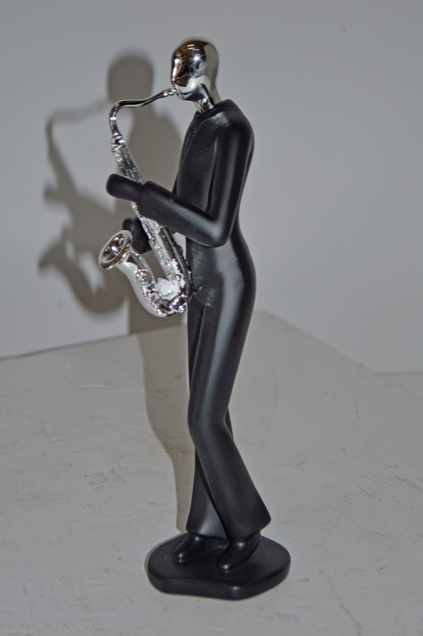 Modern Art Black and Chrome Man Play Saxophone Resin Statue - Size: 4"x3"x11"H