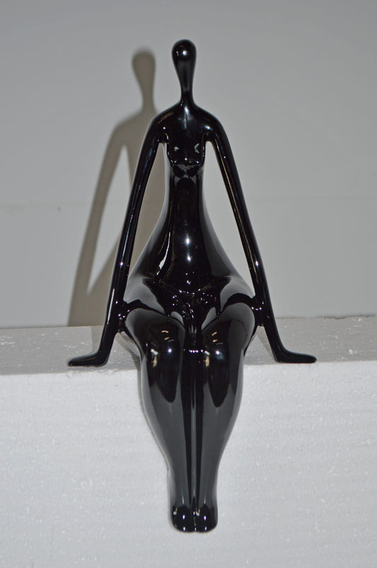 Modern Art Black Sitting on Edge Girl Made of Resin - Size: 8"L x 6"W x 15"H.