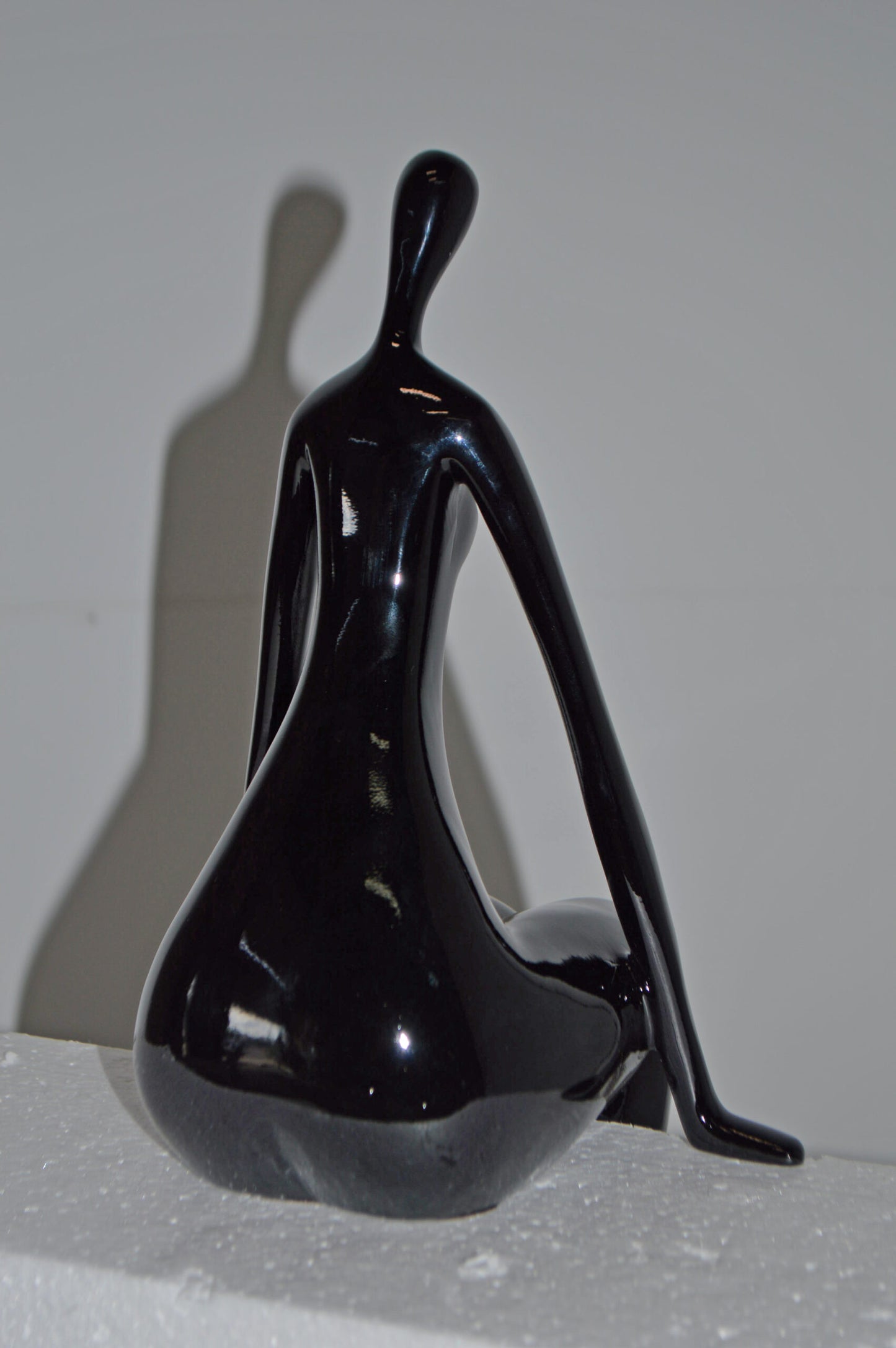 Modern Art Black Sitting on Edge Girl Made of Resin - Size: 8"L x 6"W x 15"H.