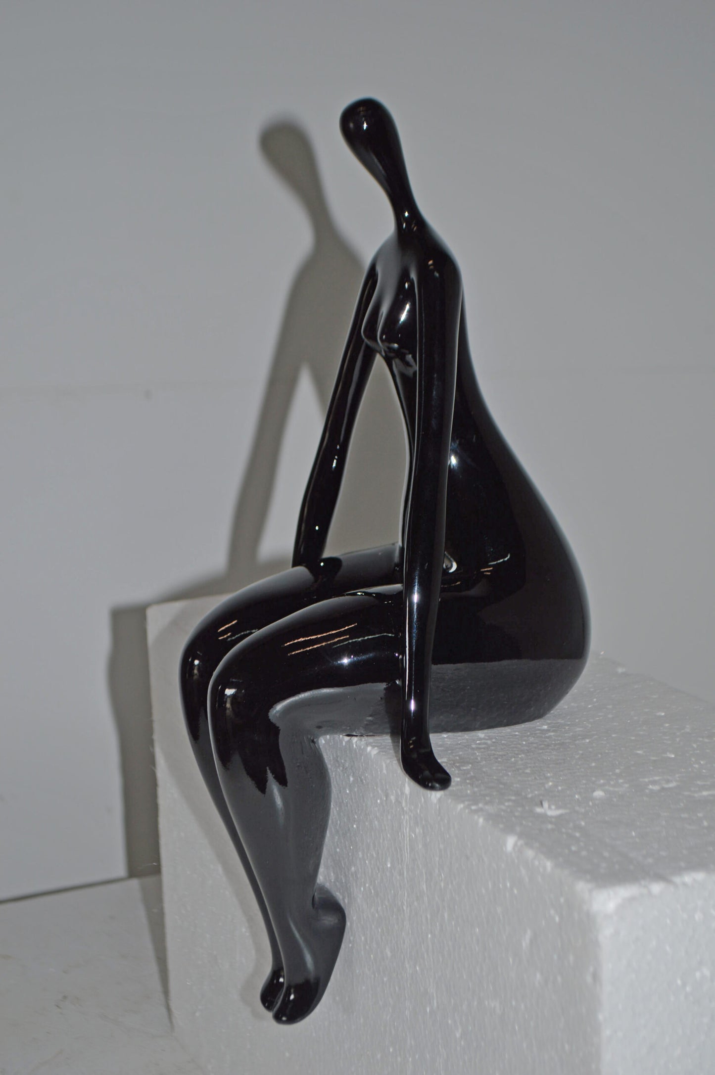 Modern Art Black Sitting on Edge Girl Made of Resin - Size: 8"L x 6"W x 15"H.