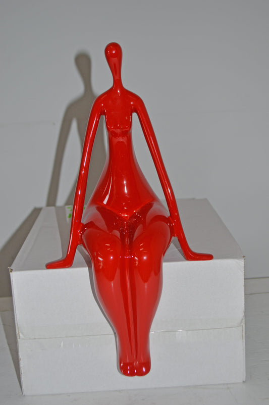 Modern Art Red Sitting on Edge Girl Made of Resin - Size: 8"L x 6"W x 15"H.