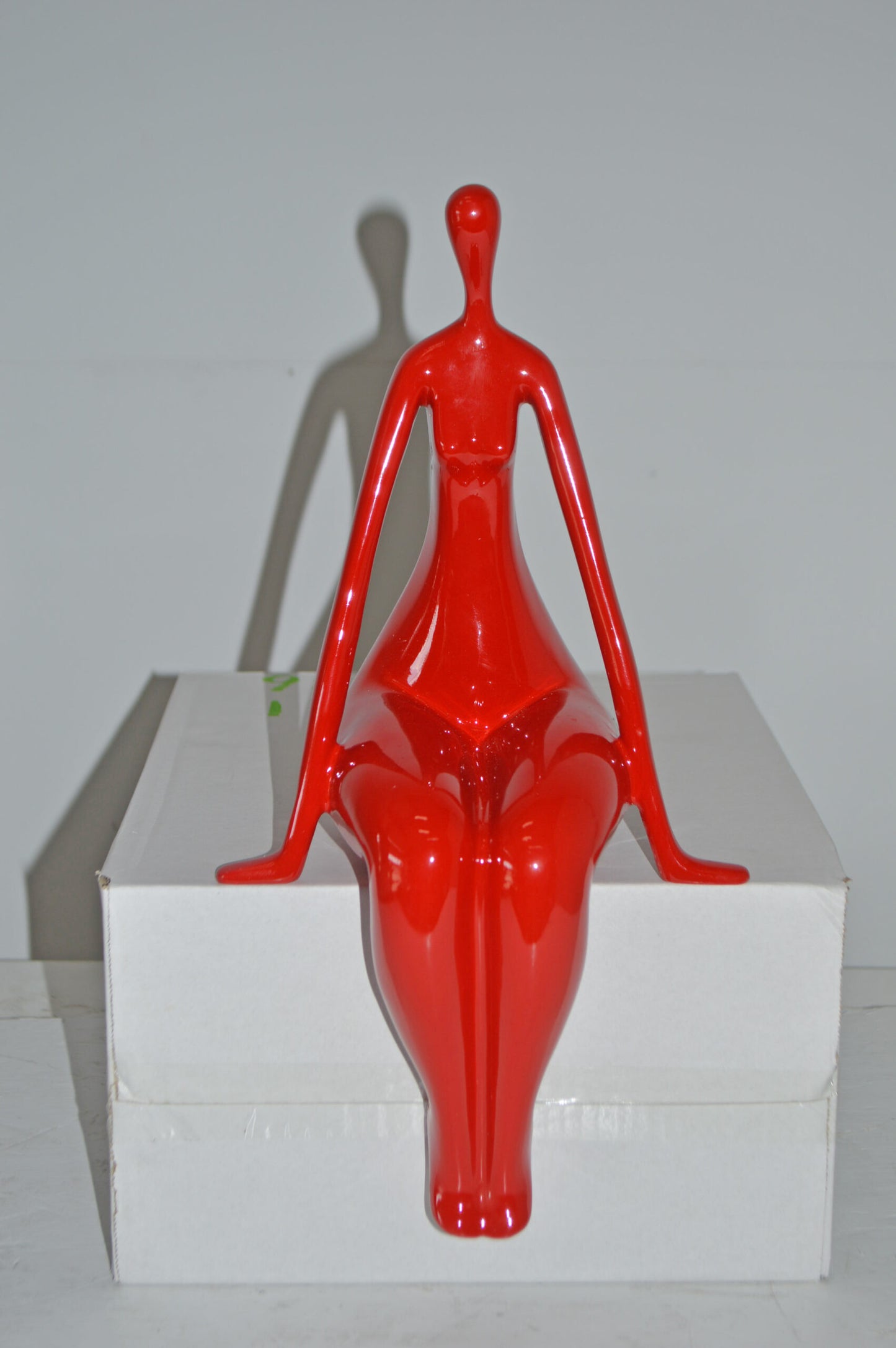 Modern Art Red Sitting on Edge Girl Made of Resin - Size: 8"L x 6"W x 15"H.