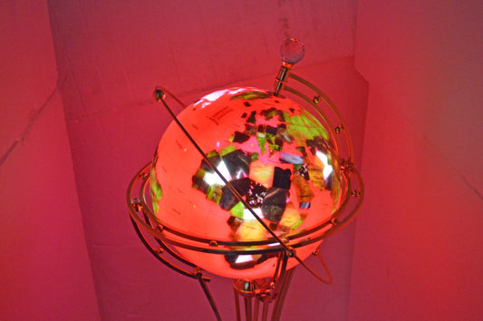 Illuminated Red - Gold World Globe Rotated by motor - Size: 19"L x 19"W x 42"H.