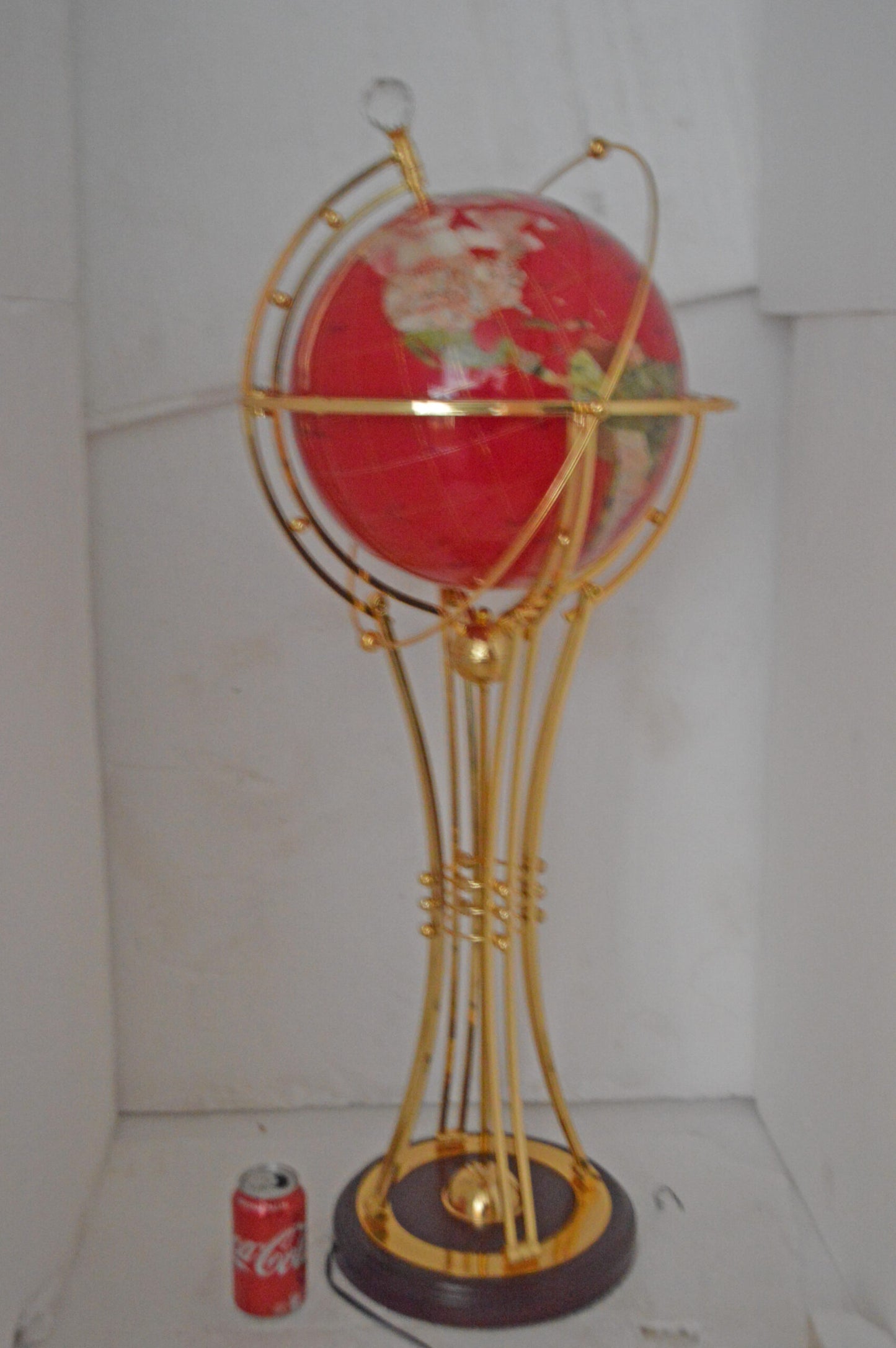 Illuminated Red - Gold World Globe Rotated by motor - Size: 19"L x 19"W x 42"H.