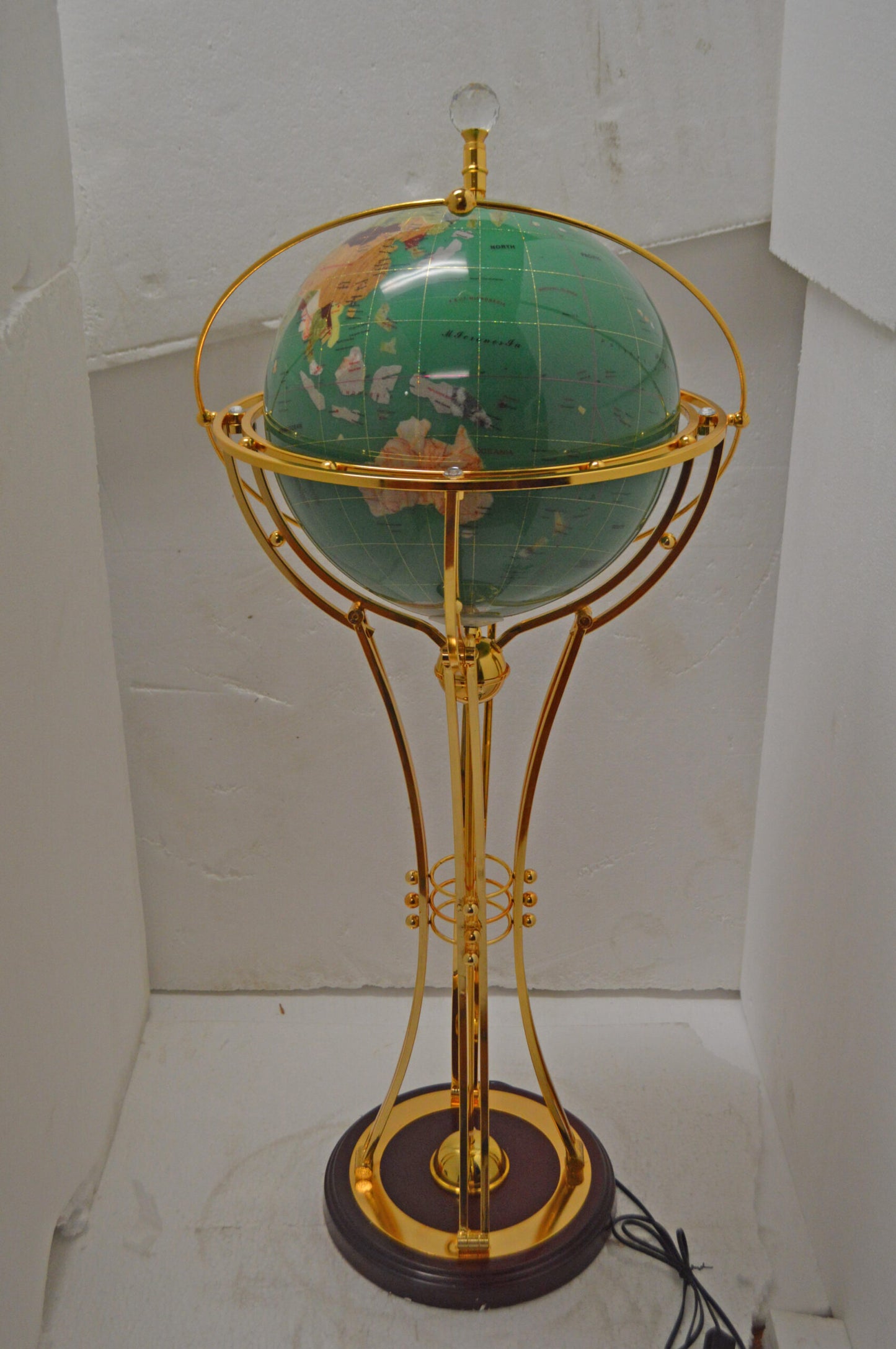 Illuminated Green - Gold World Globe Rotated by a motor - Size: 19" x 19" x 42"H