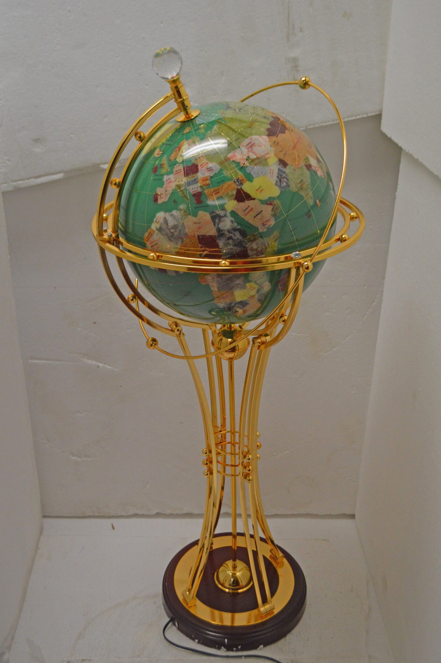 Illuminated Green - Gold World Globe Rotated by a motor - Size: 19" x 19" x 42"H
