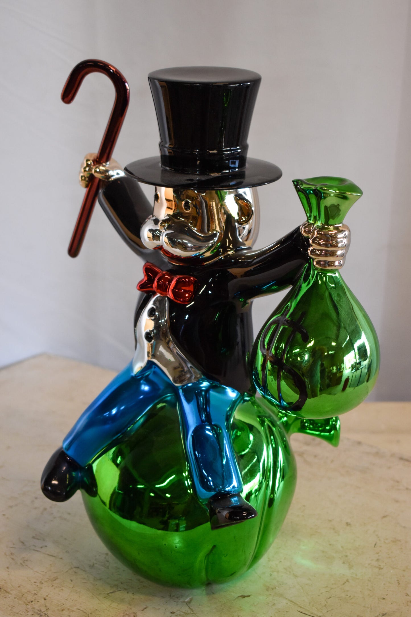 Joyous Monopoly Man Sitting on Money Bag Resin Statue 12" x 10" x 16"H