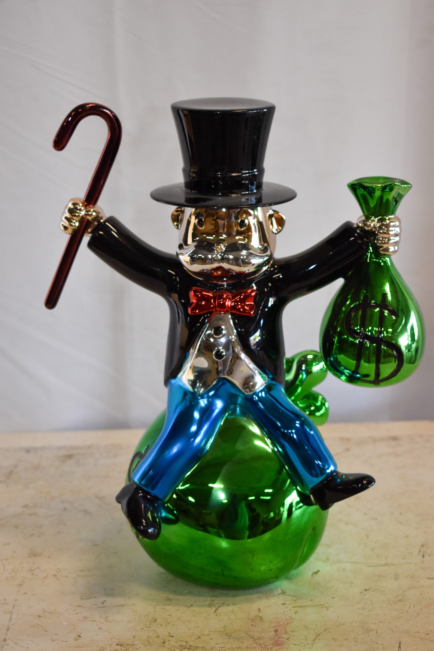 Joyous Monopoly Man Sitting on Money Bag Resin Statue 12" x 10" x 16"H