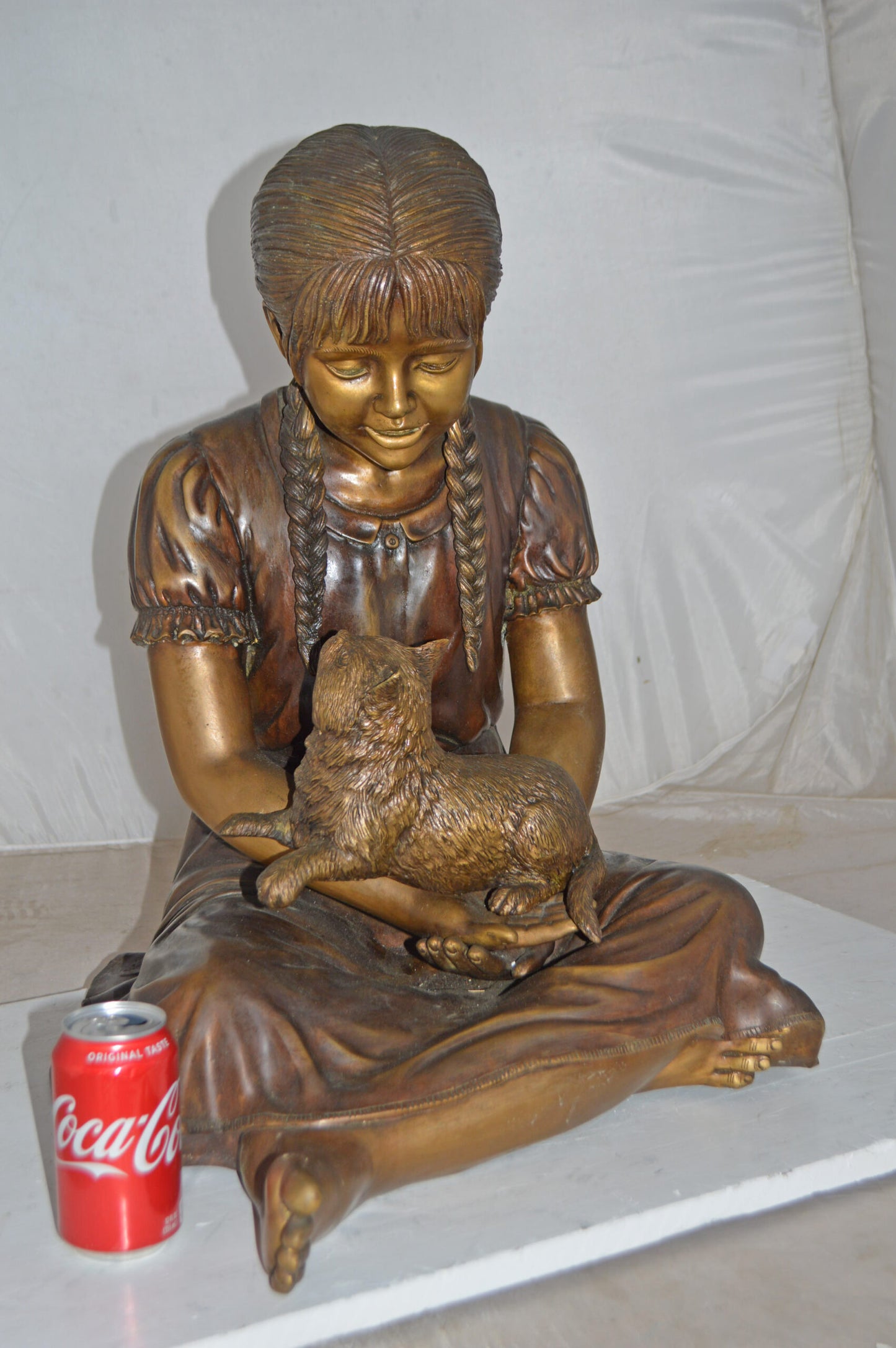 Girl Holding Her Cat Life Size Bronze Statue - Size: 23"L x 20"W x 24"H.
