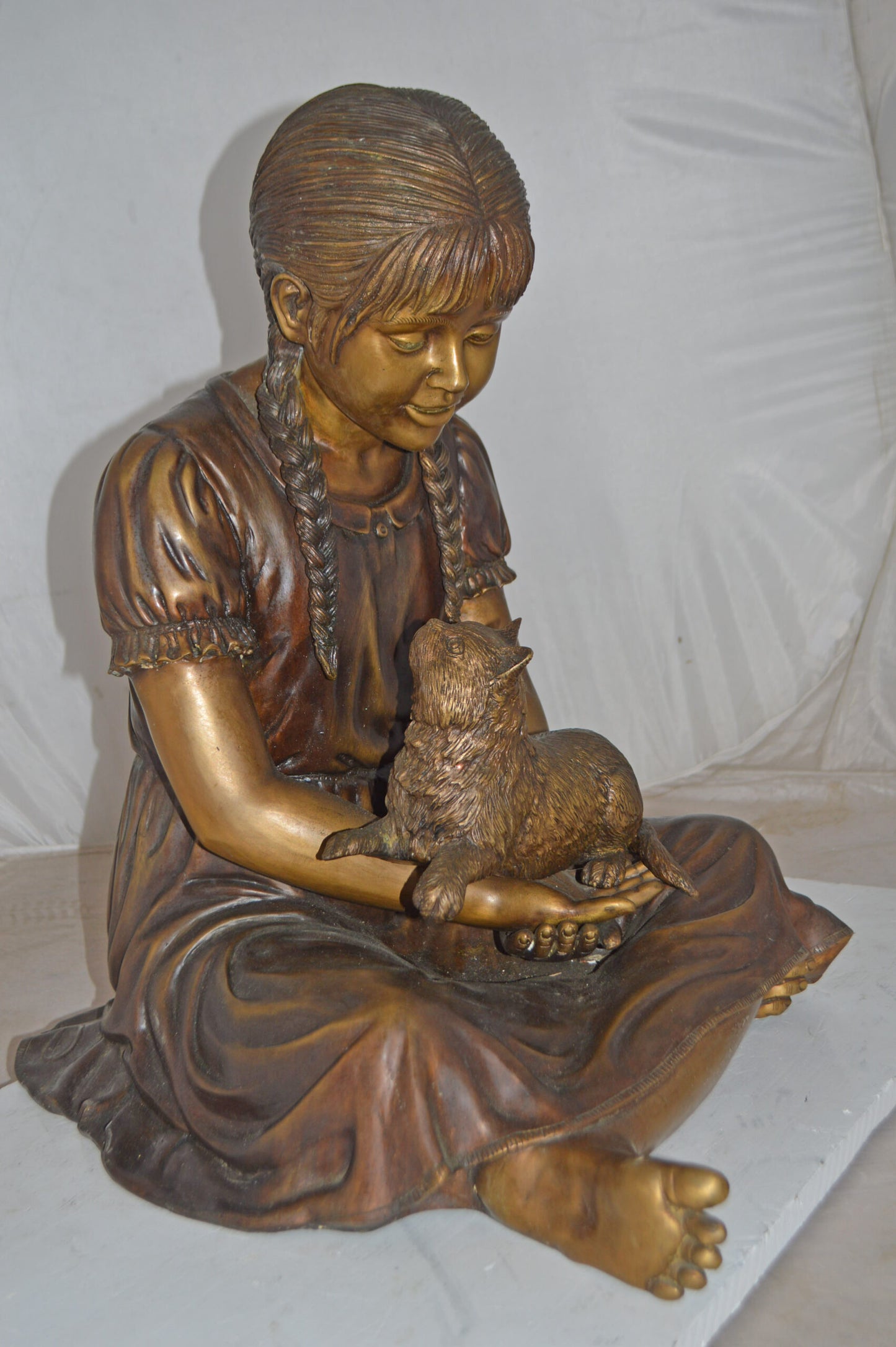 Girl Holding Her Cat Life Size Bronze Statue - Size: 23"L x 20"W x 24"H.