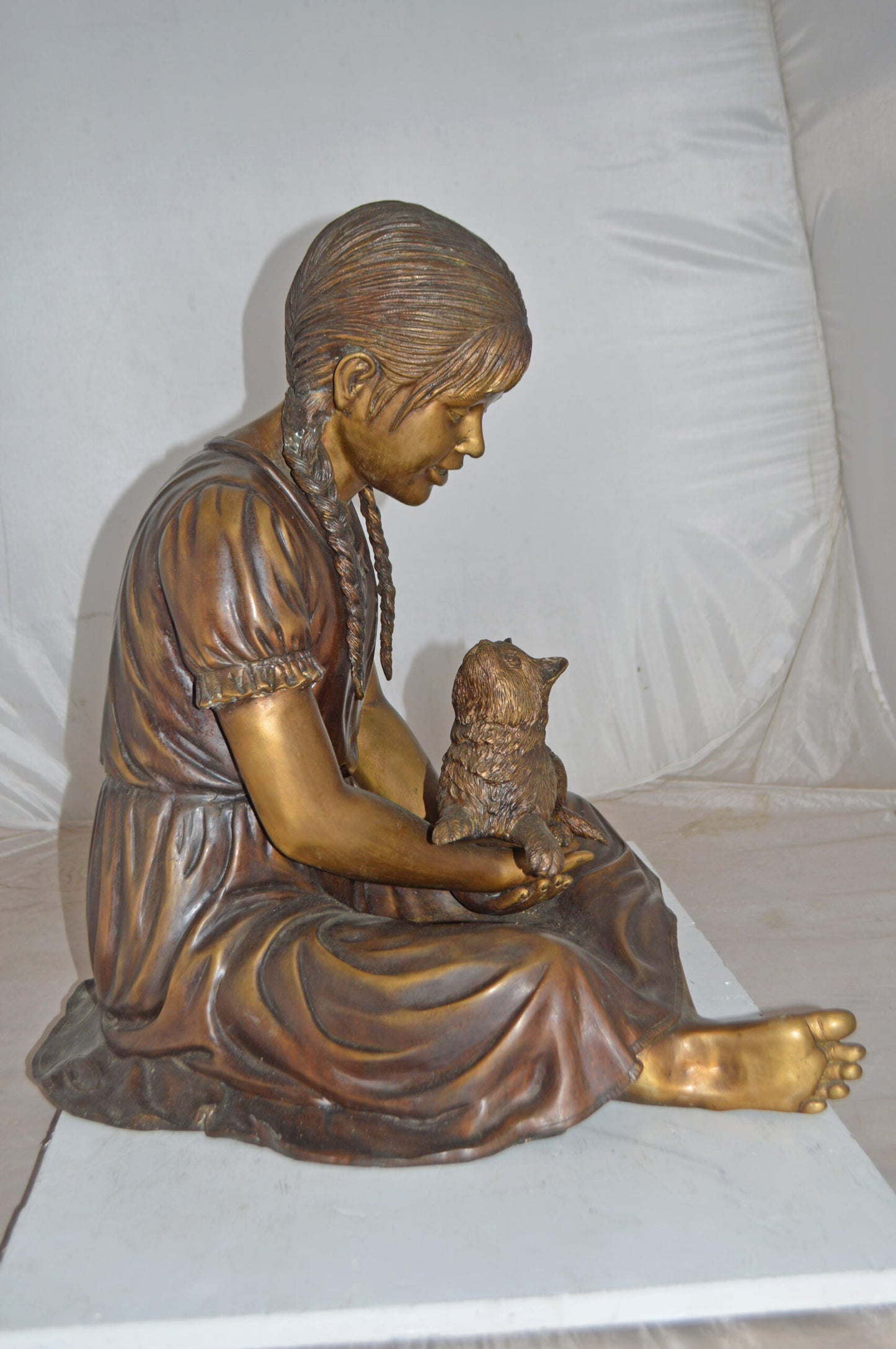 Girl Holding Her Cat Life Size Bronze Statue - Size: 23"L x 20"W x 24"H.