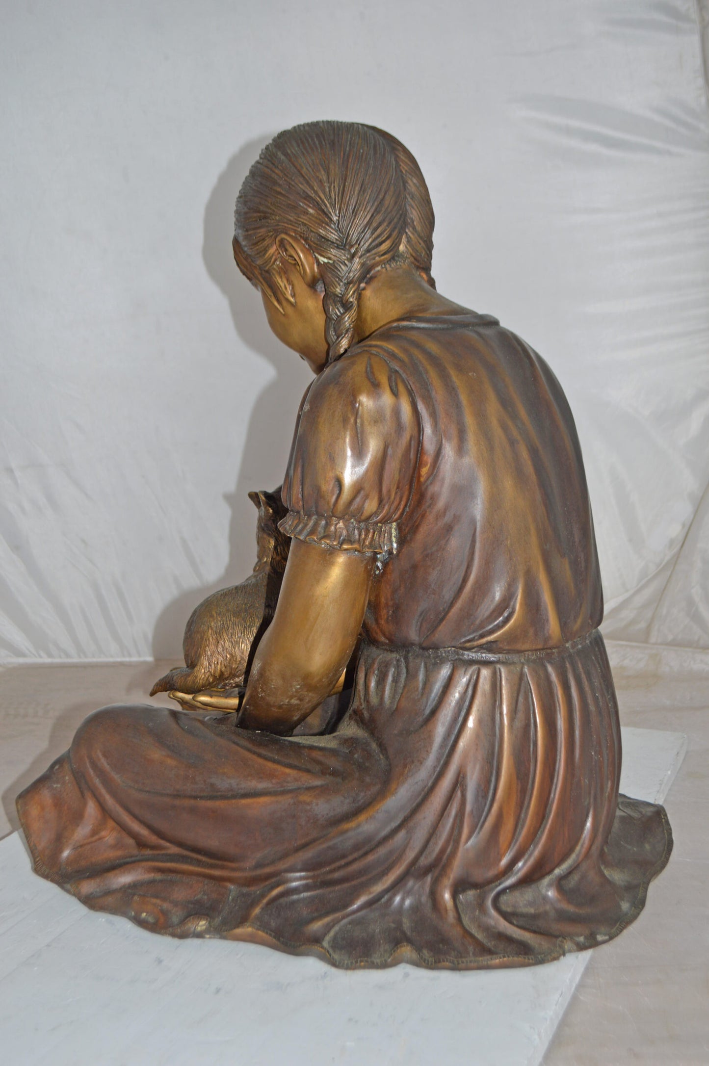 Girl Holding Her Cat Life Size Bronze Statue - Size: 23"L x 20"W x 24"H.