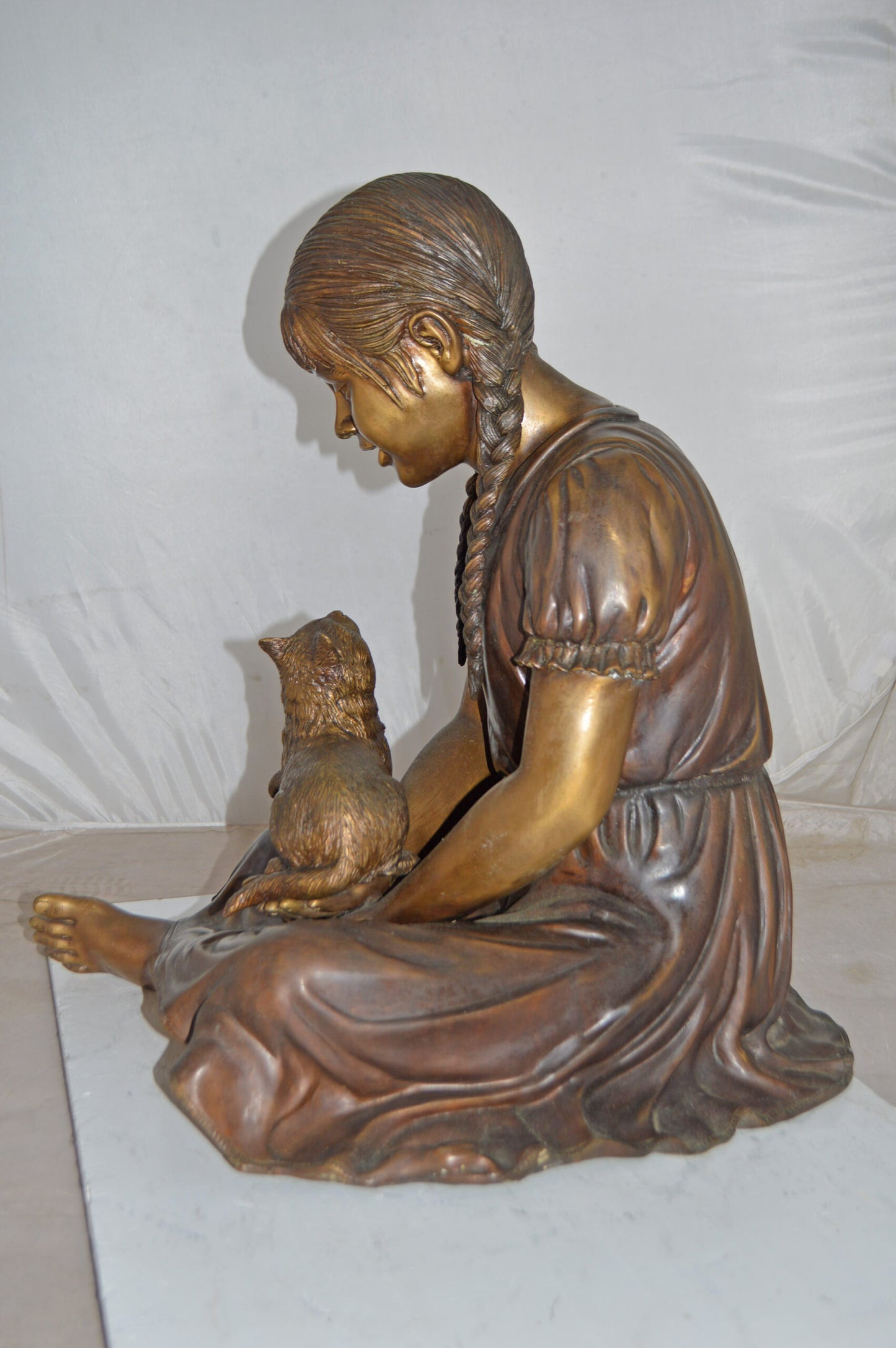 Girl Holding Her Cat Life Size Bronze Statue - Size: 23"L x 20"W x 24"H.
