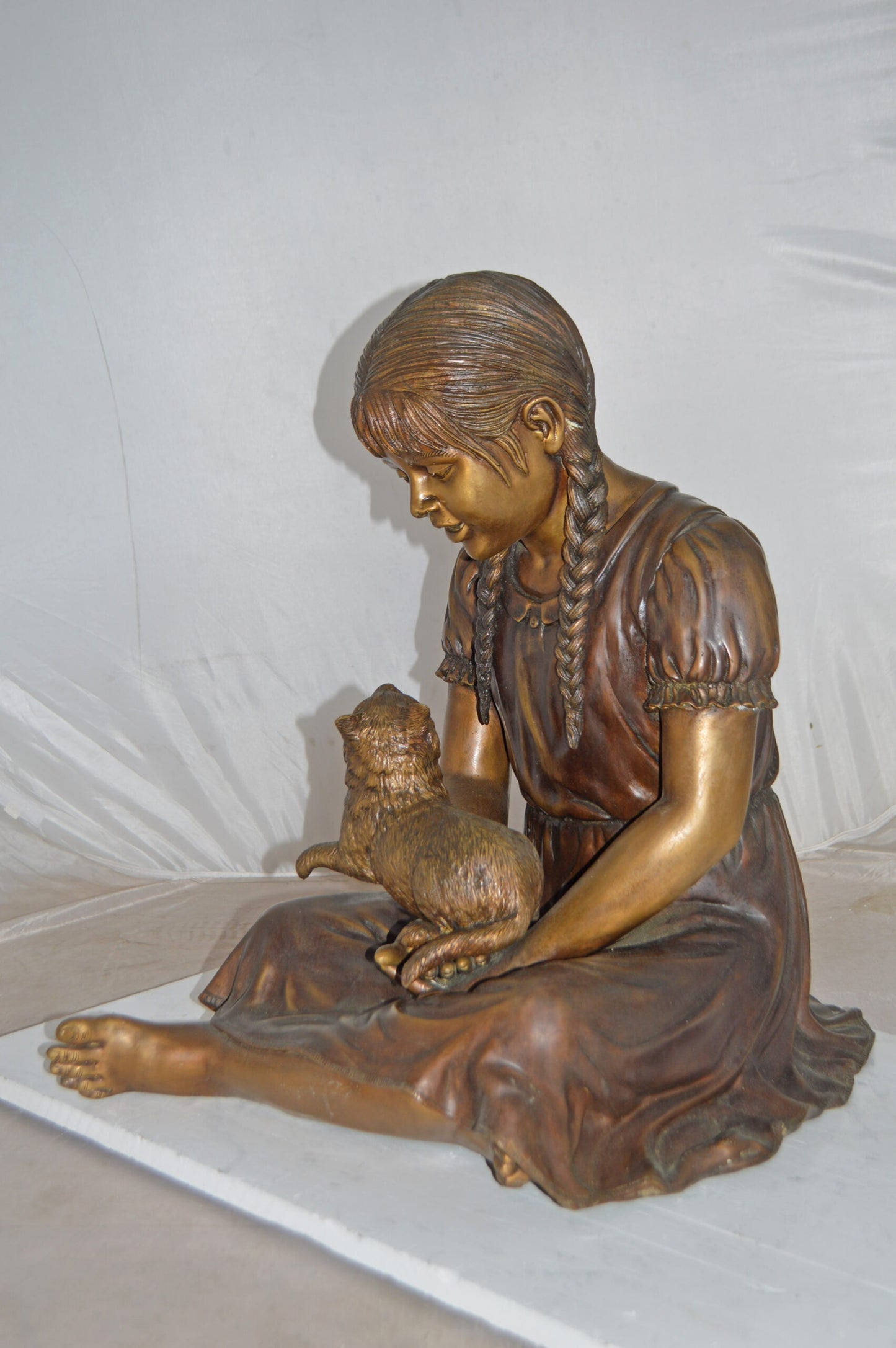 Girl Holding Her Cat Life Size Bronze Statue - Size: 23"L x 20"W x 24"H.