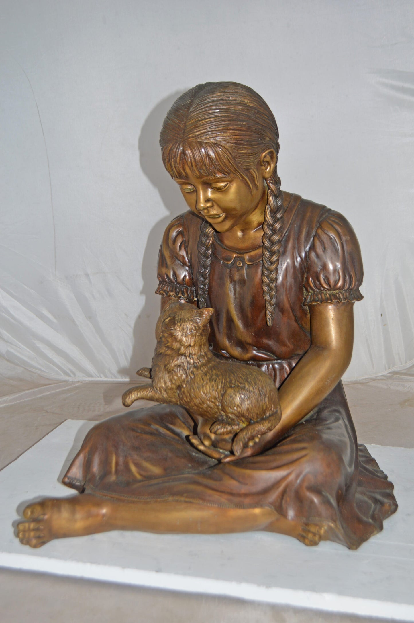 Girl Holding Her Cat Life Size Bronze Statue - Size: 23"L x 20"W x 24"H.