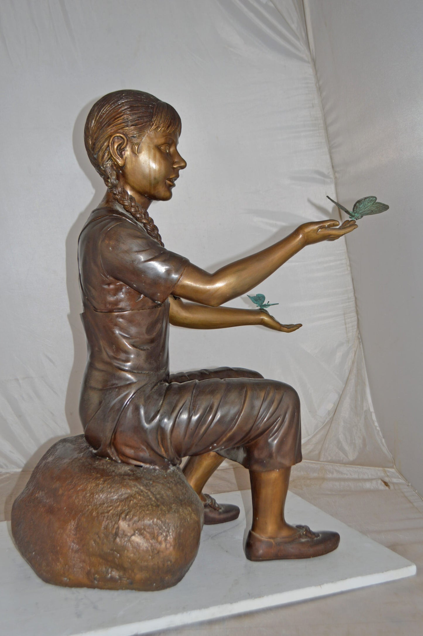 Girl Sitting on A Rock Holding Butterflies Bronze Statue - Size: 26"x17"x34"H