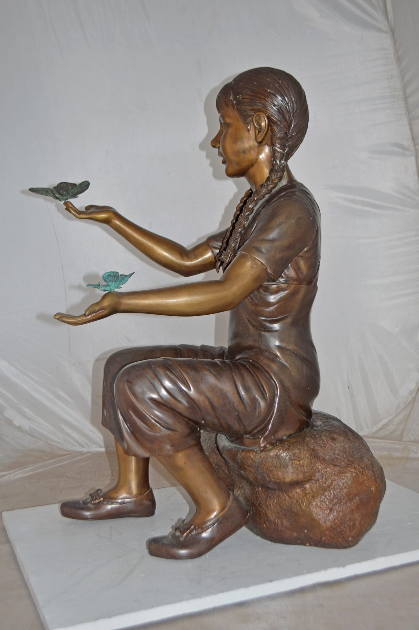 Girl Sitting on A Rock Holding Butterflies Bronze Statue - Size: 26"x17"x34"H