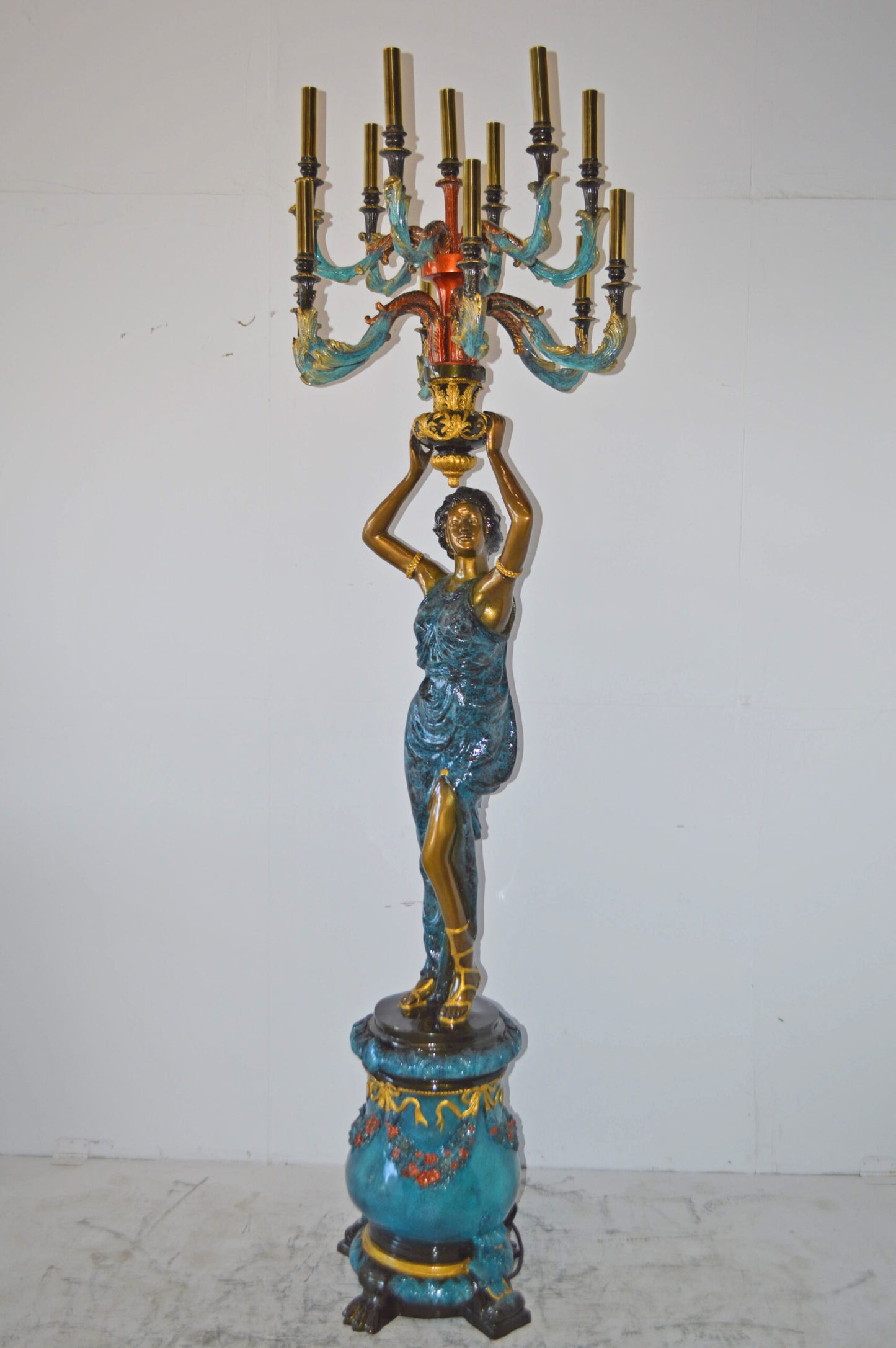 A Pair of Ladies holding a Lamp Bronze Statue - Size: 30"L x 30"W x 100"H.