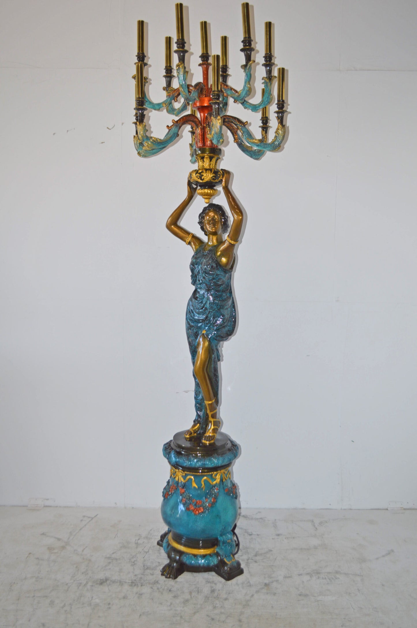 A Pair of Ladies holding a Lamp Bronze Statue - Size: 30"L x 30"W x 100"H.