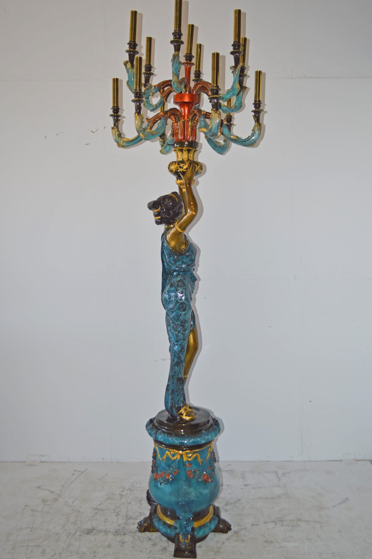 A Pair of Ladies holding a Lamp Bronze Statue - Size: 30"L x 30"W x 100"H.