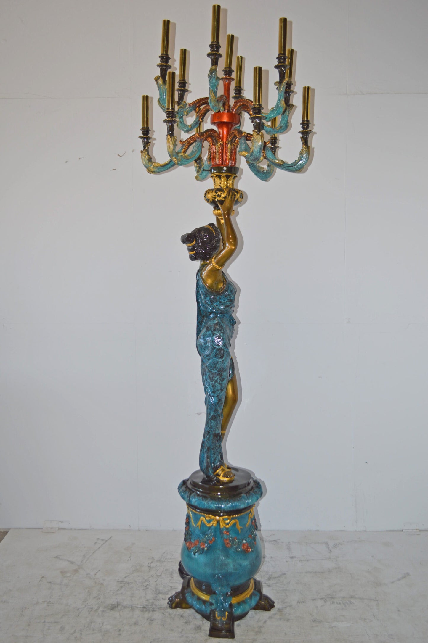 A Pair of Ladies holding a Lamp Bronze Statue - Size: 30"L x 30"W x 100"H.