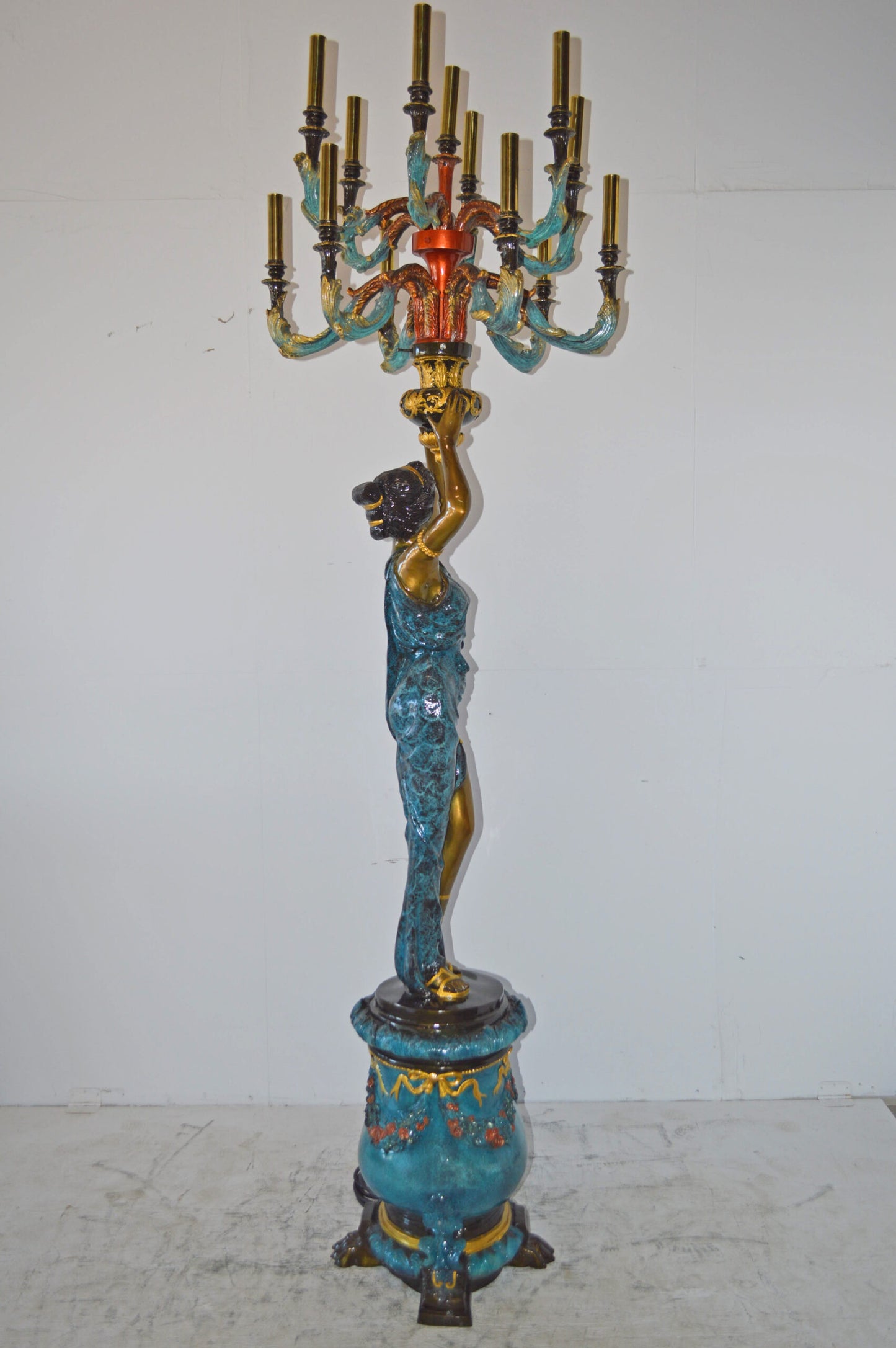 A Pair of Ladies holding a Lamp Bronze Statue - Size: 30"L x 30"W x 100"H.
