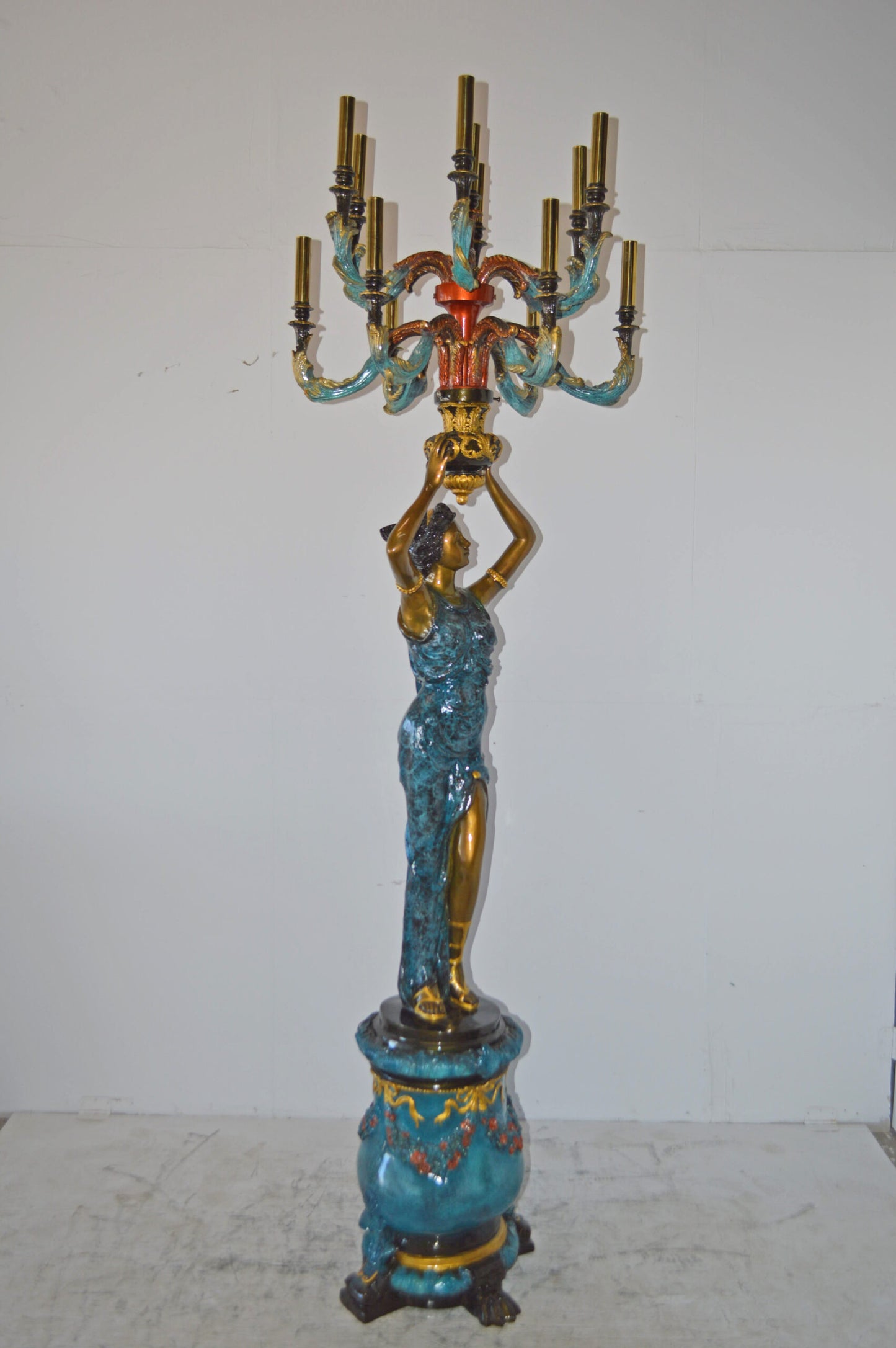 A Pair of Ladies holding a Lamp Bronze Statue - Size: 30"L x 30"W x 100"H.