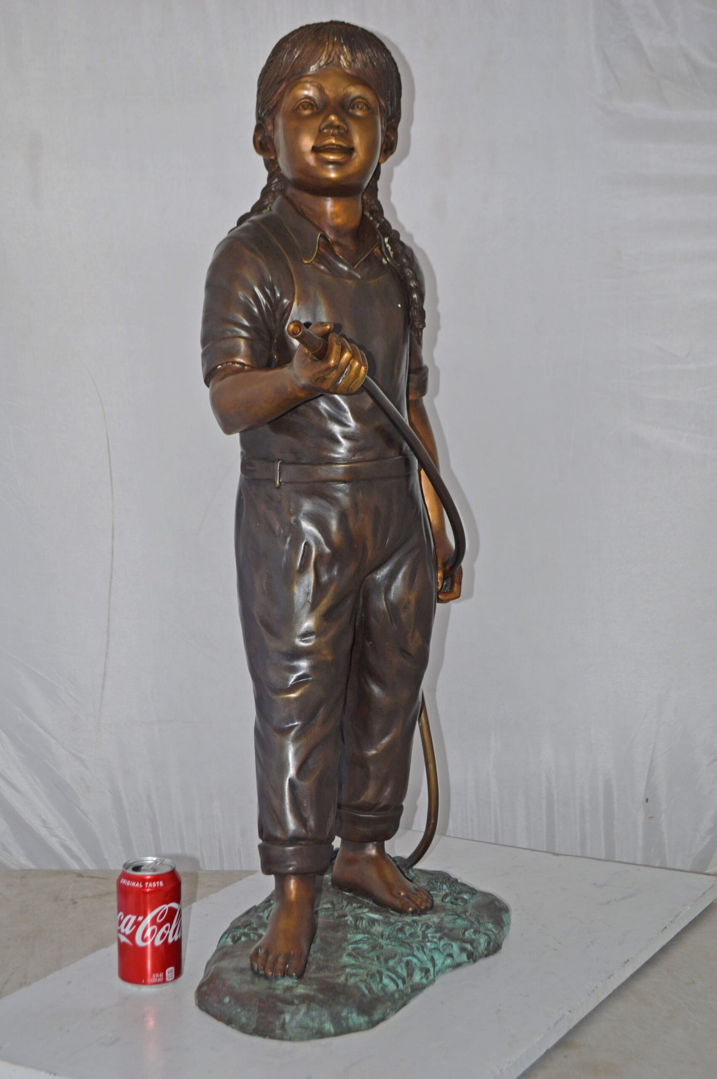 A Girl Holding A Garden Hose Bronze Statue Fountain - Size: 13"L x 20"W x 39"H.