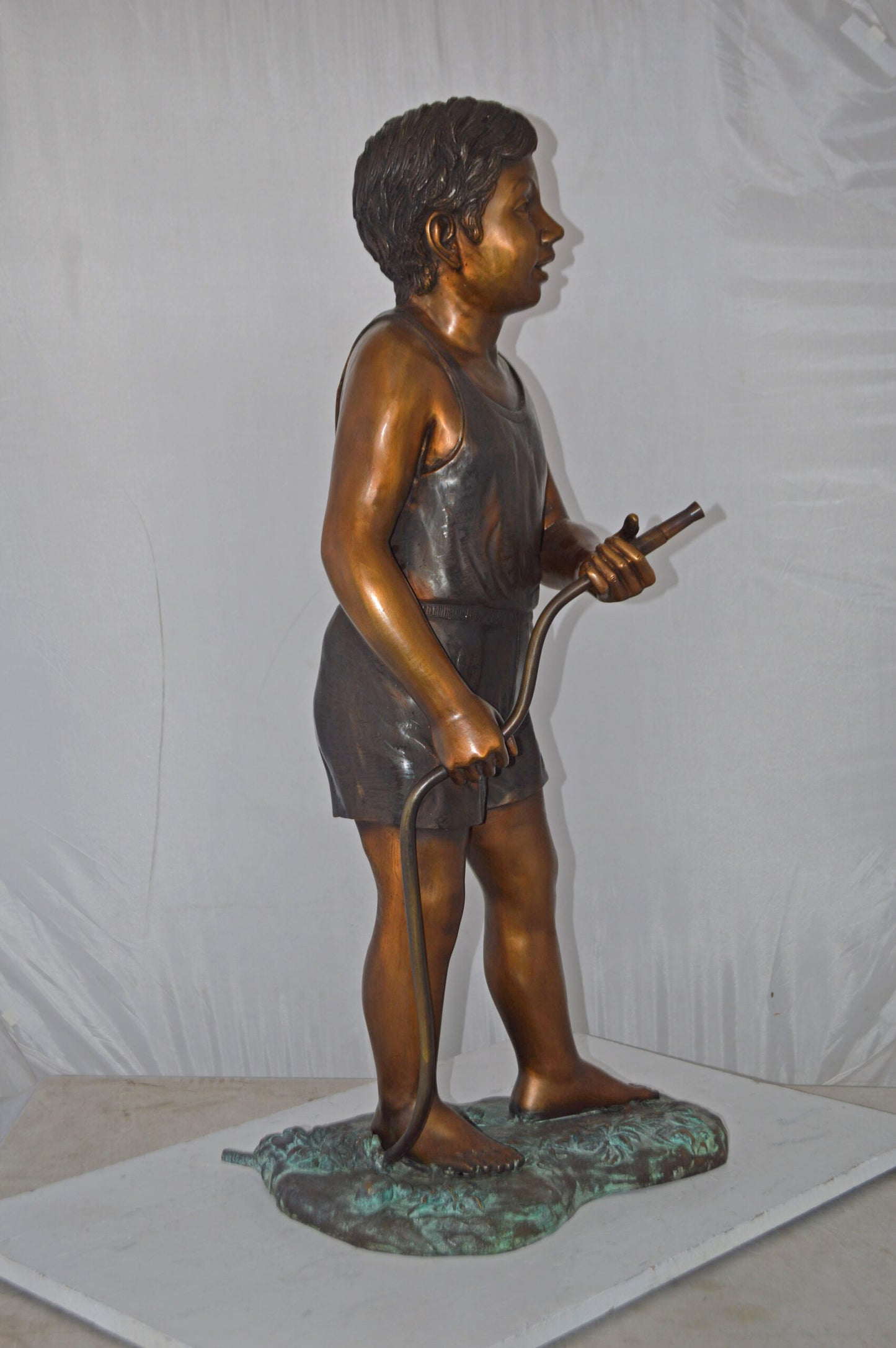 A Boy Holding A Garden Hose Bronze Statue Fountain - Size: 13"L x 20"W x 39"H.