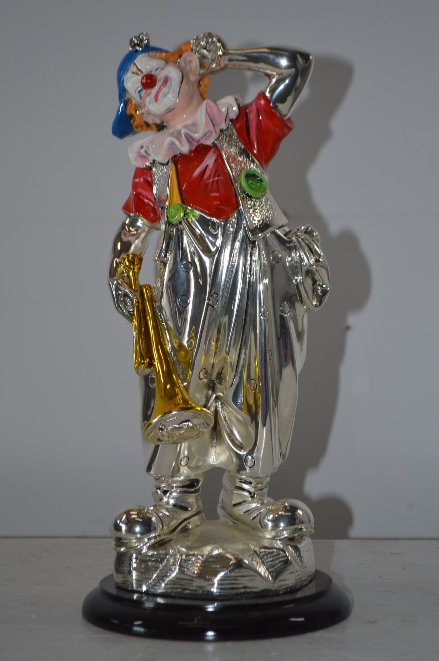 Clown plays Trumpet Resin Statue Silver finish - Size: 6"L x 6"W x 17"H.