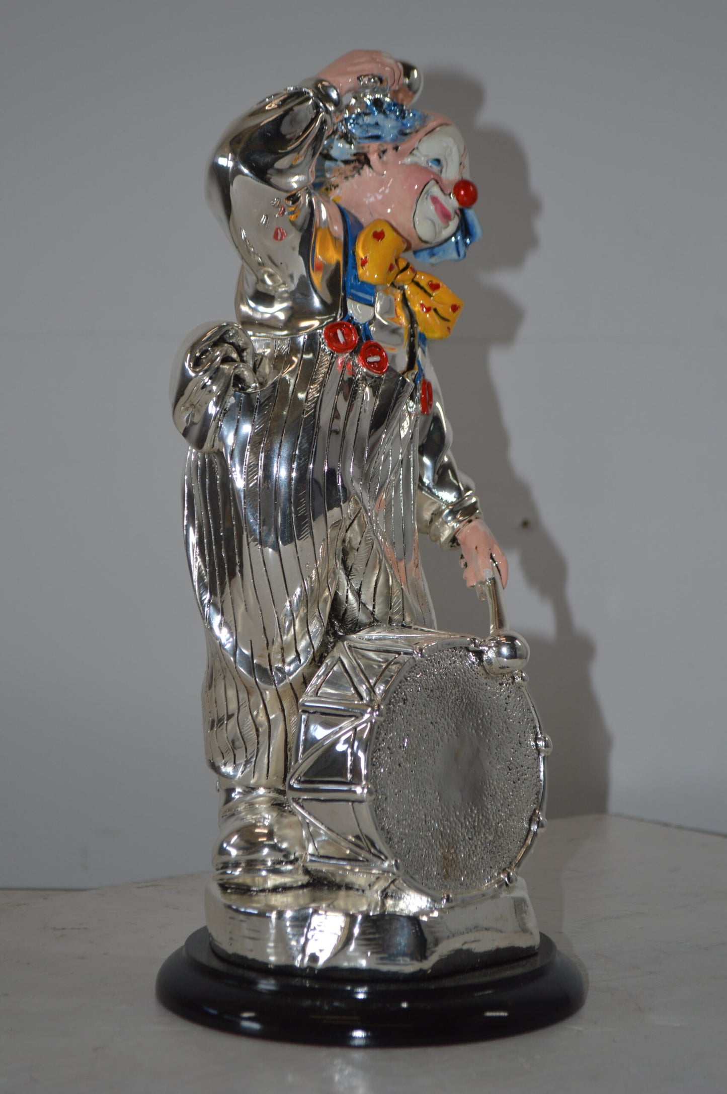 Clown Plays the Drams Resin Statue Silver finish - Size: 6"L x 6"W x 16"H.