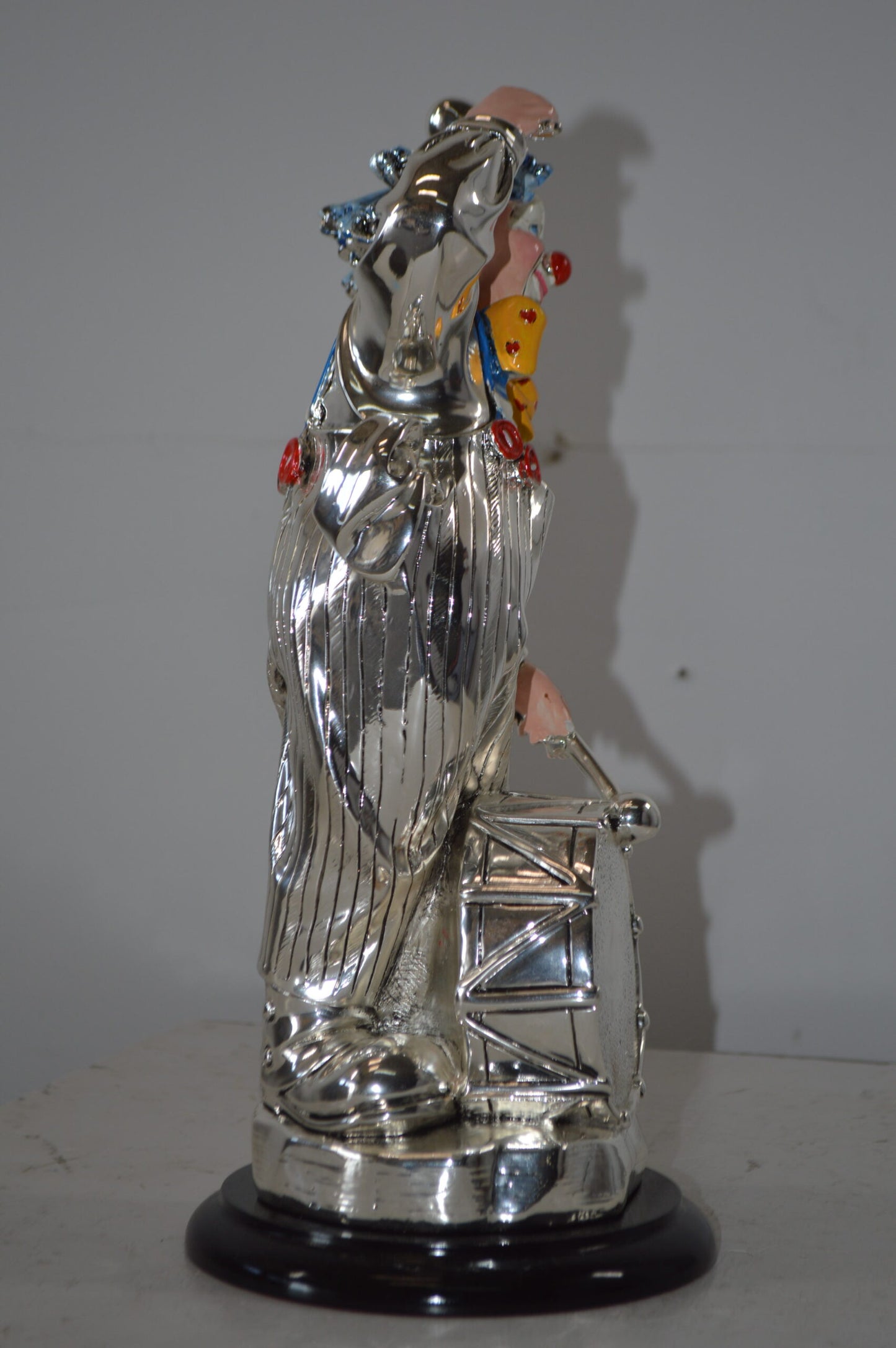 Clown Plays the Drams Resin Statue Silver finish - Size: 6"L x 6"W x 16"H.