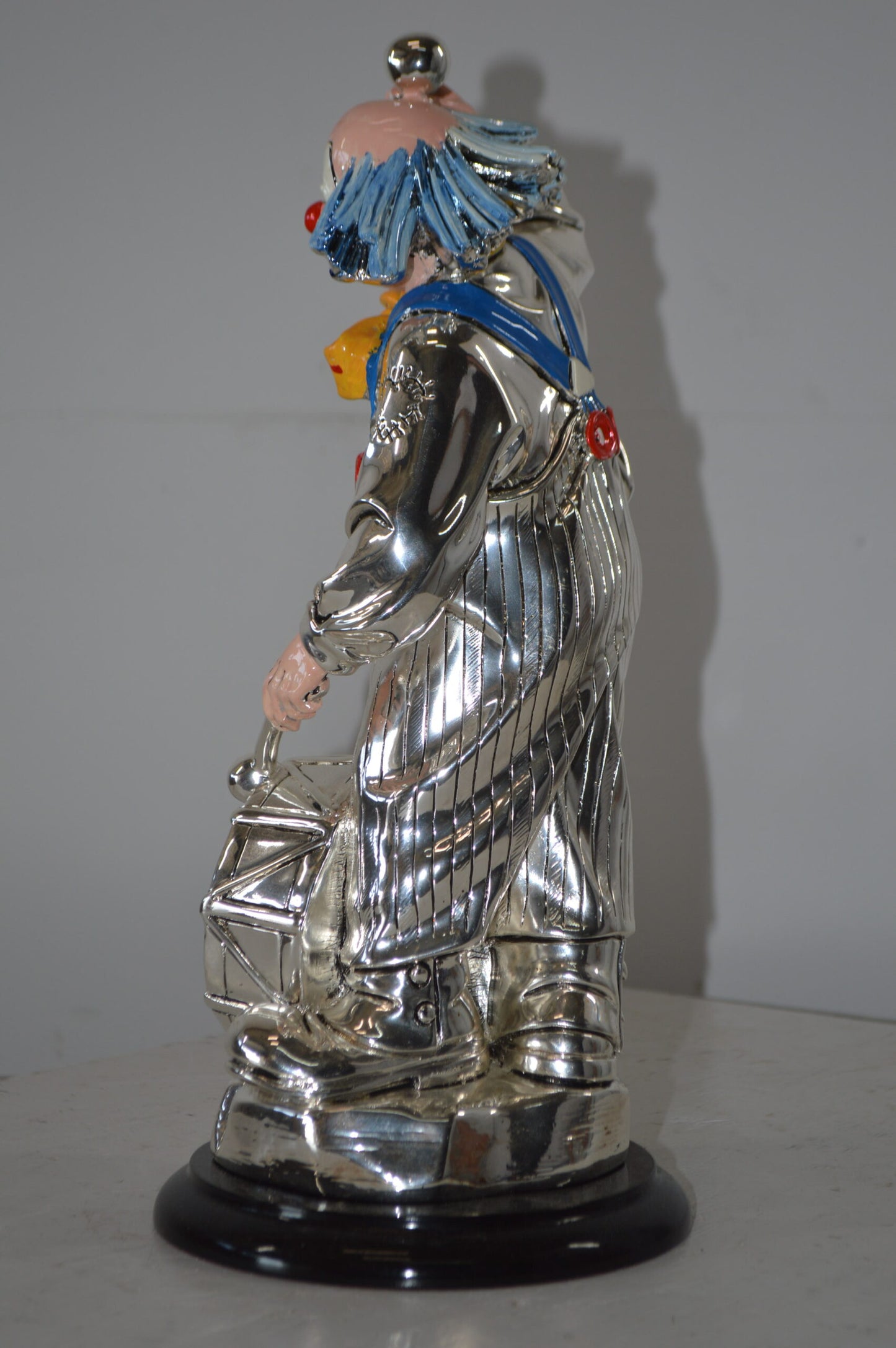 Clown Plays the Drams Resin Statue Silver finish - Size: 6"L x 6"W x 16"H.