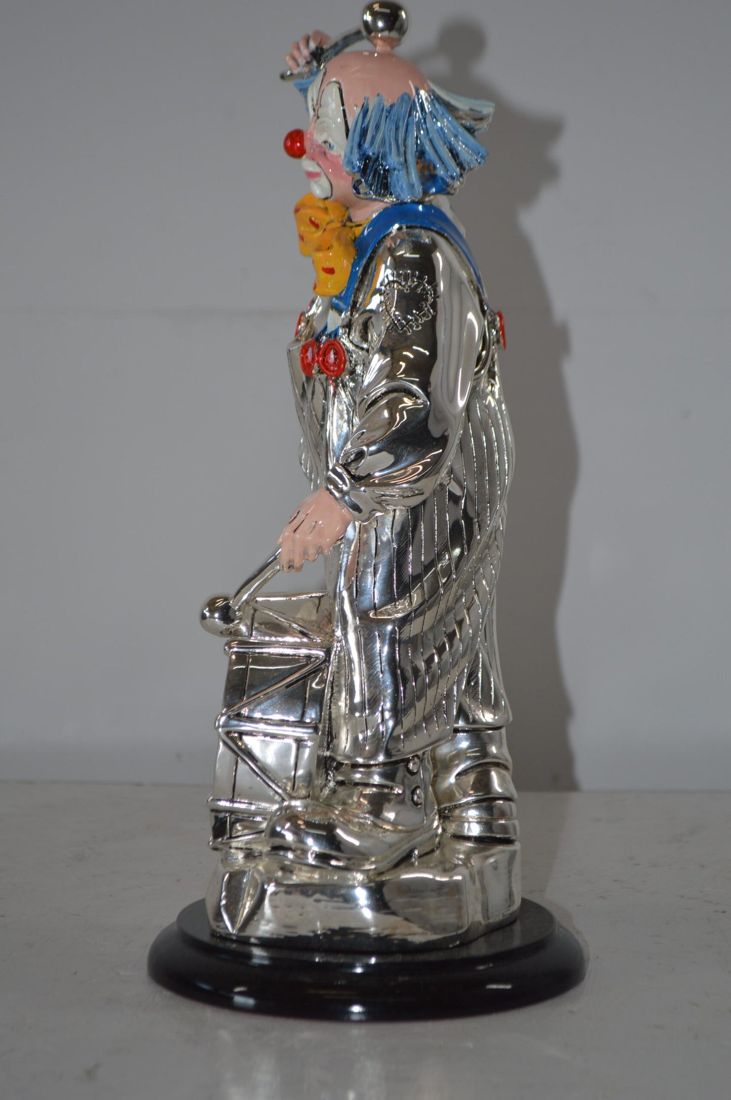 Clown Plays the Drams Resin Statue Silver finish - Size: 6"L x 6"W x 16"H.
