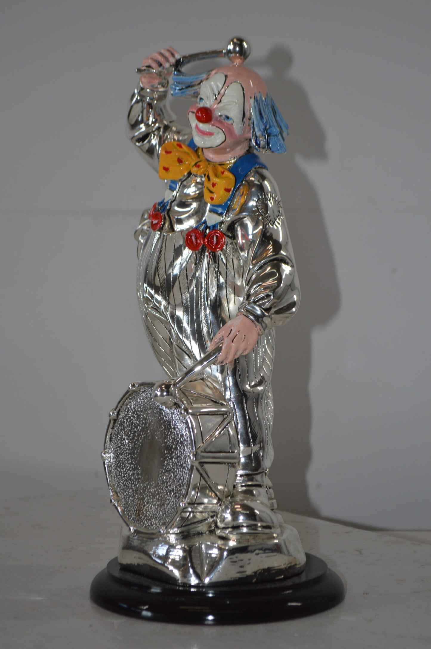 Clown Plays the Drams Resin Statue Silver finish - Size: 6"L x 6"W x 16"H.