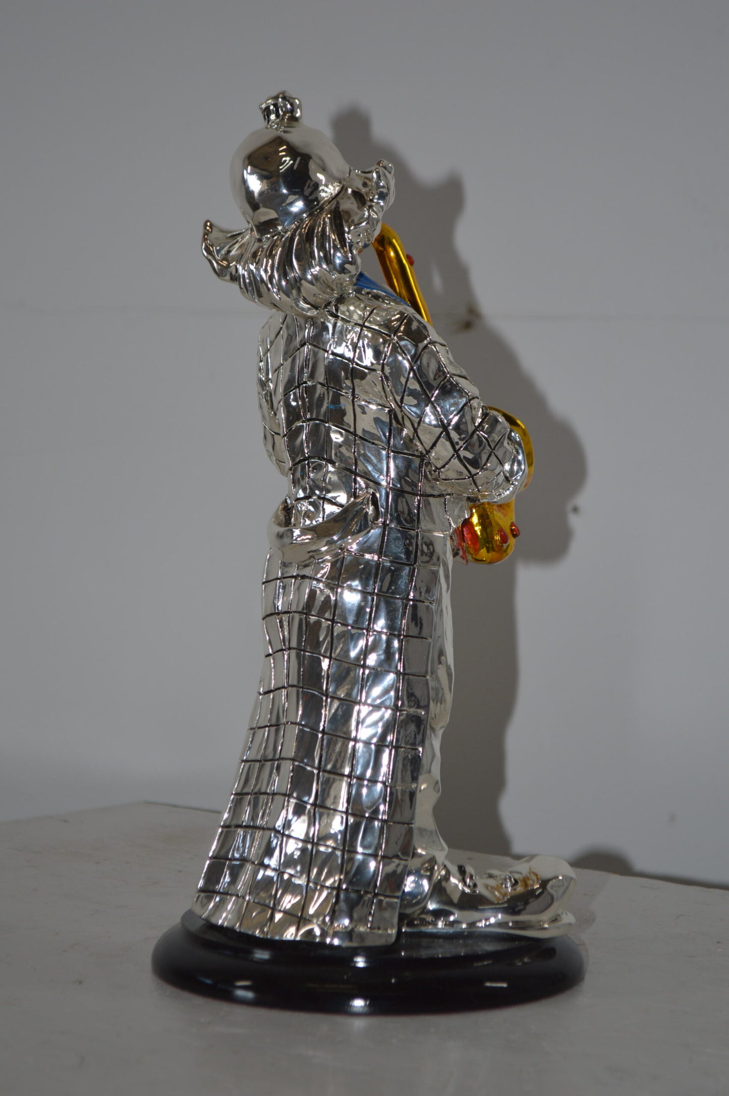 Clown Plays the Saxophone Resin Statue Silver finish - Size: 6"L x 6"W x 14"H.