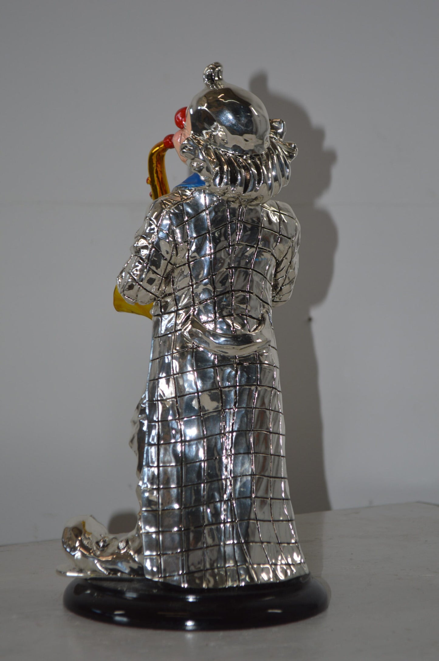 Clown Plays the Saxophone Resin Statue Silver finish - Size: 6"L x 6"W x 14"H.