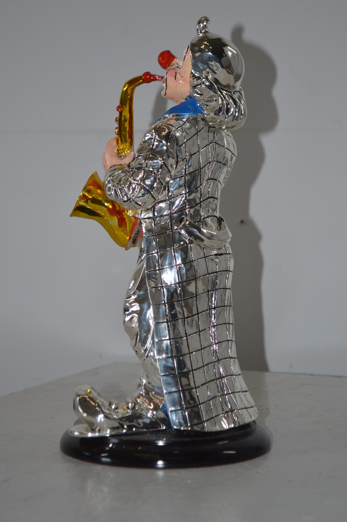 Clown Plays the Saxophone Resin Statue Silver finish - Size: 6"L x 6"W x 14"H.